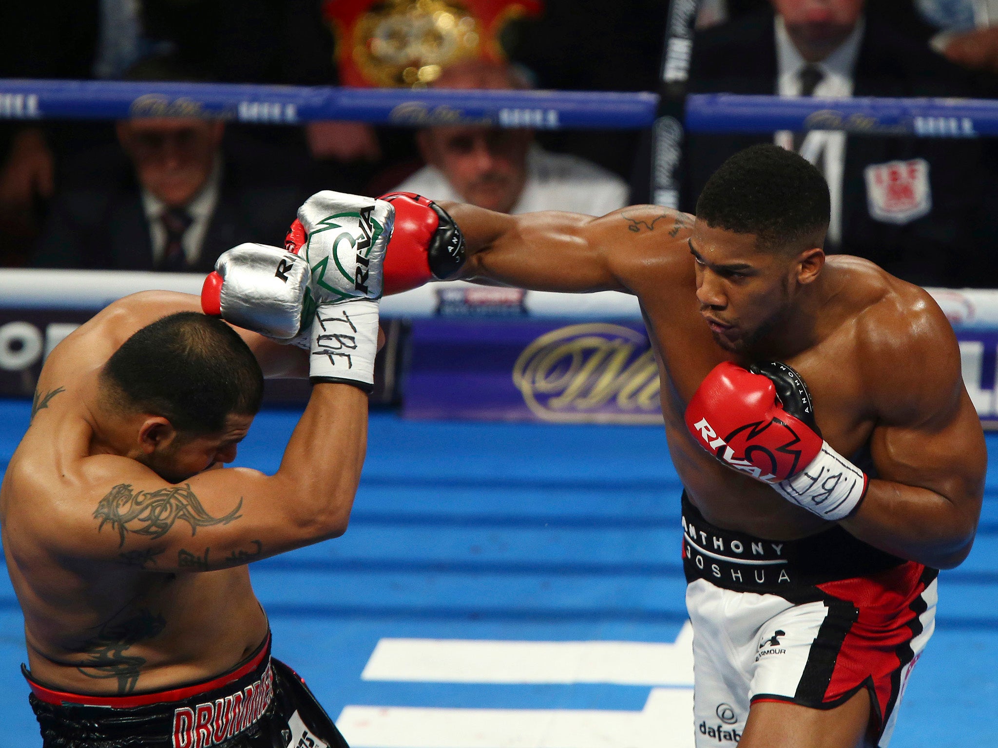 Anthony Joshua throws a punch at opponent Eric Molina