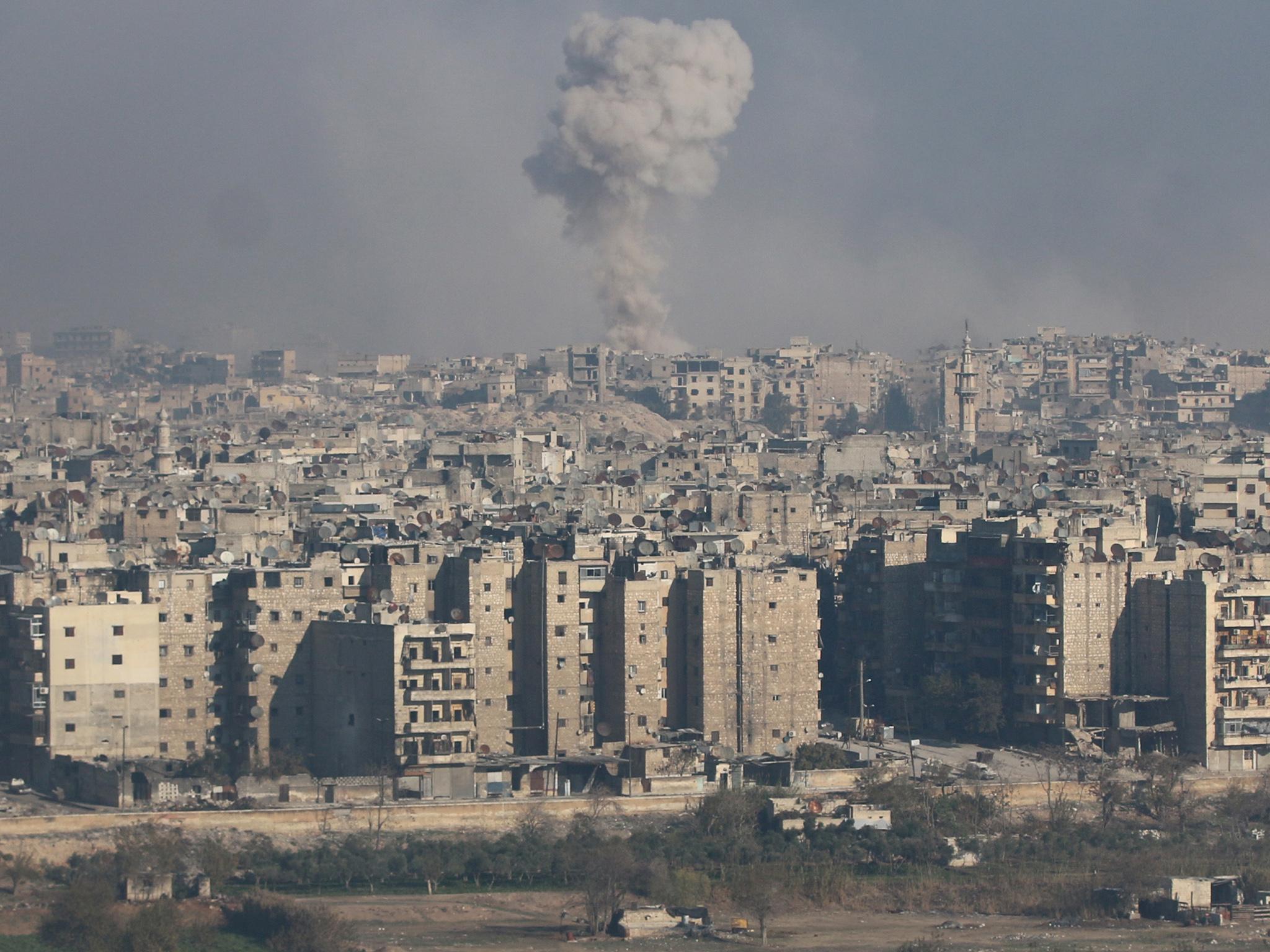 Smoke rises from a rebel-held area of Aleppo, where government forces have been bombing relentlessly over the past month