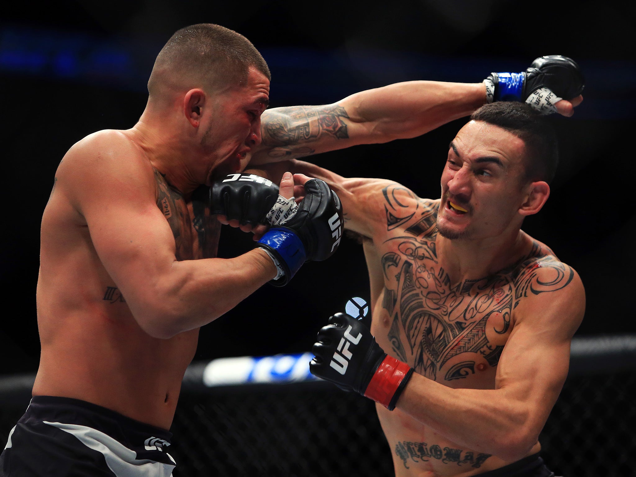 Holloway, right, claimed victory by technical knock-out