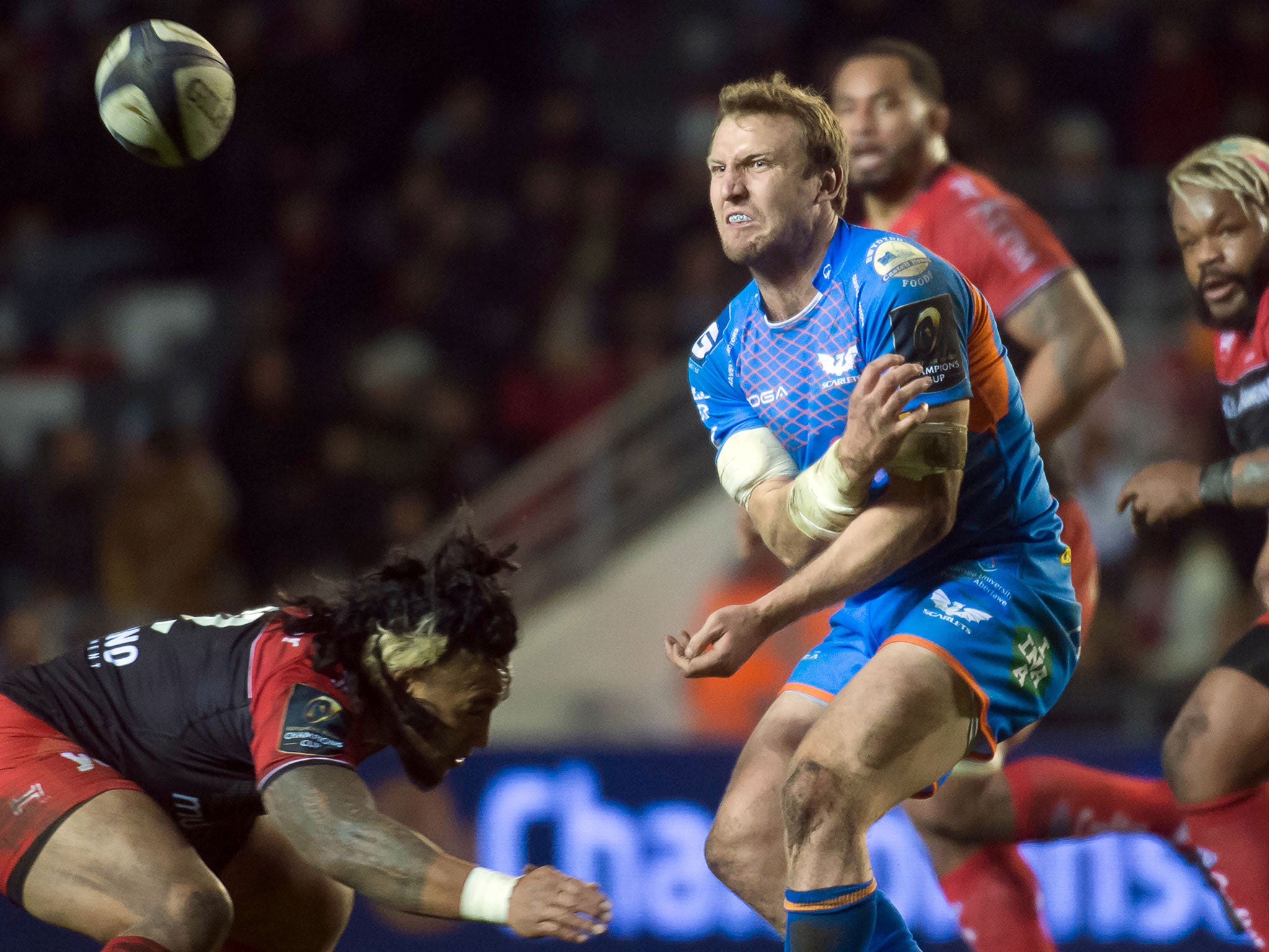 Scott Williams braces himself for a challenge from New Zealand centre Maa Nonu after getting his pass away