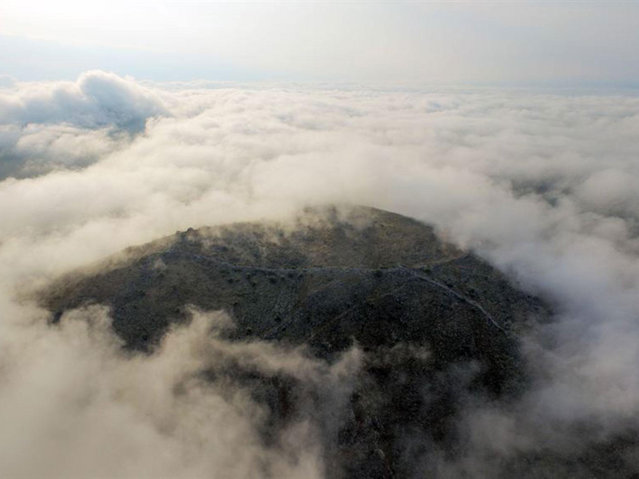 The city’s acropolis is barely visible during a cloudy day on the Thessalian plains