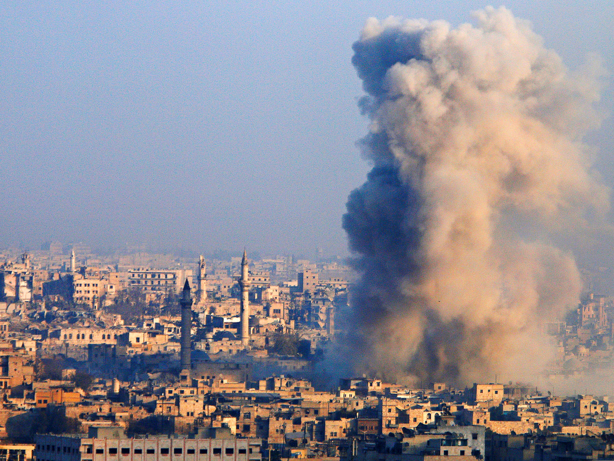 Smoke rises as seen from a governement-held area of Aleppo, Syria