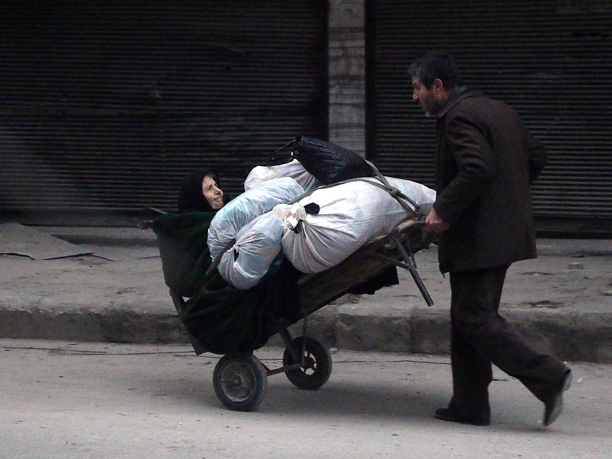 Syrian civilians flee the Sukkari neighbourhood towards safer rebel-held areas in southeastern Aleppo