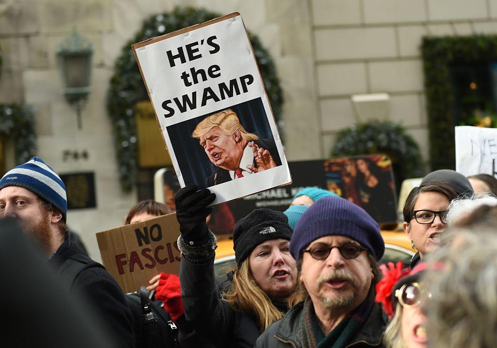 People rally as part of a nationwide protest against US President-elect Donald Trump outside of Trump Tower on December 12, 2016 in New York.