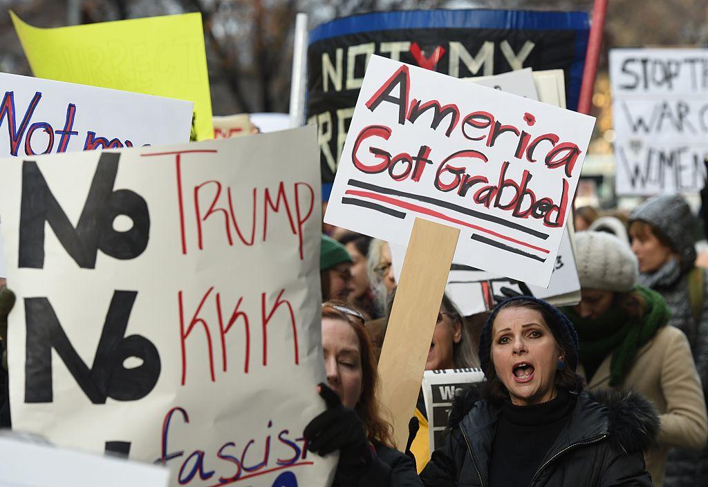 People rally as part of a nationwide protest against US President-elect Donald Trump outside of Trump Tower on December 12, 2016 in New York.
