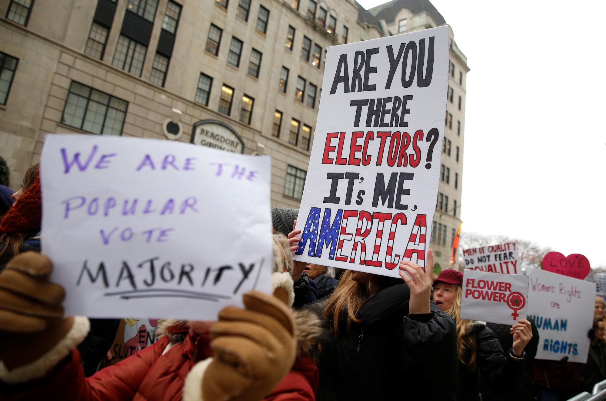 Protestors march during a demonstration against U.S. President-elect Donald Trump near Trump Tower in the Manhattan borough of New York City, December 12, 2016.