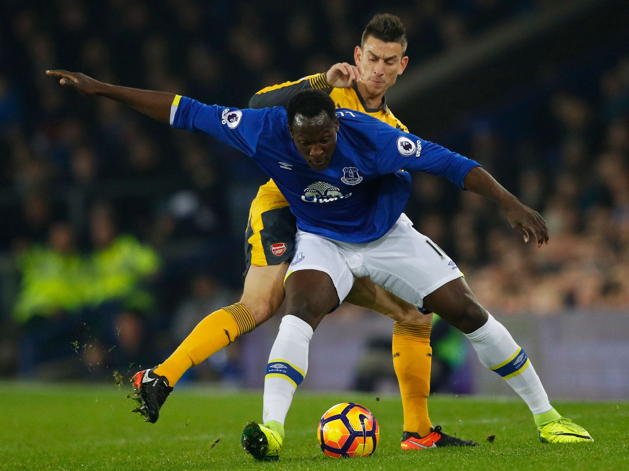 Lukaku and Koscielny vie for the ball