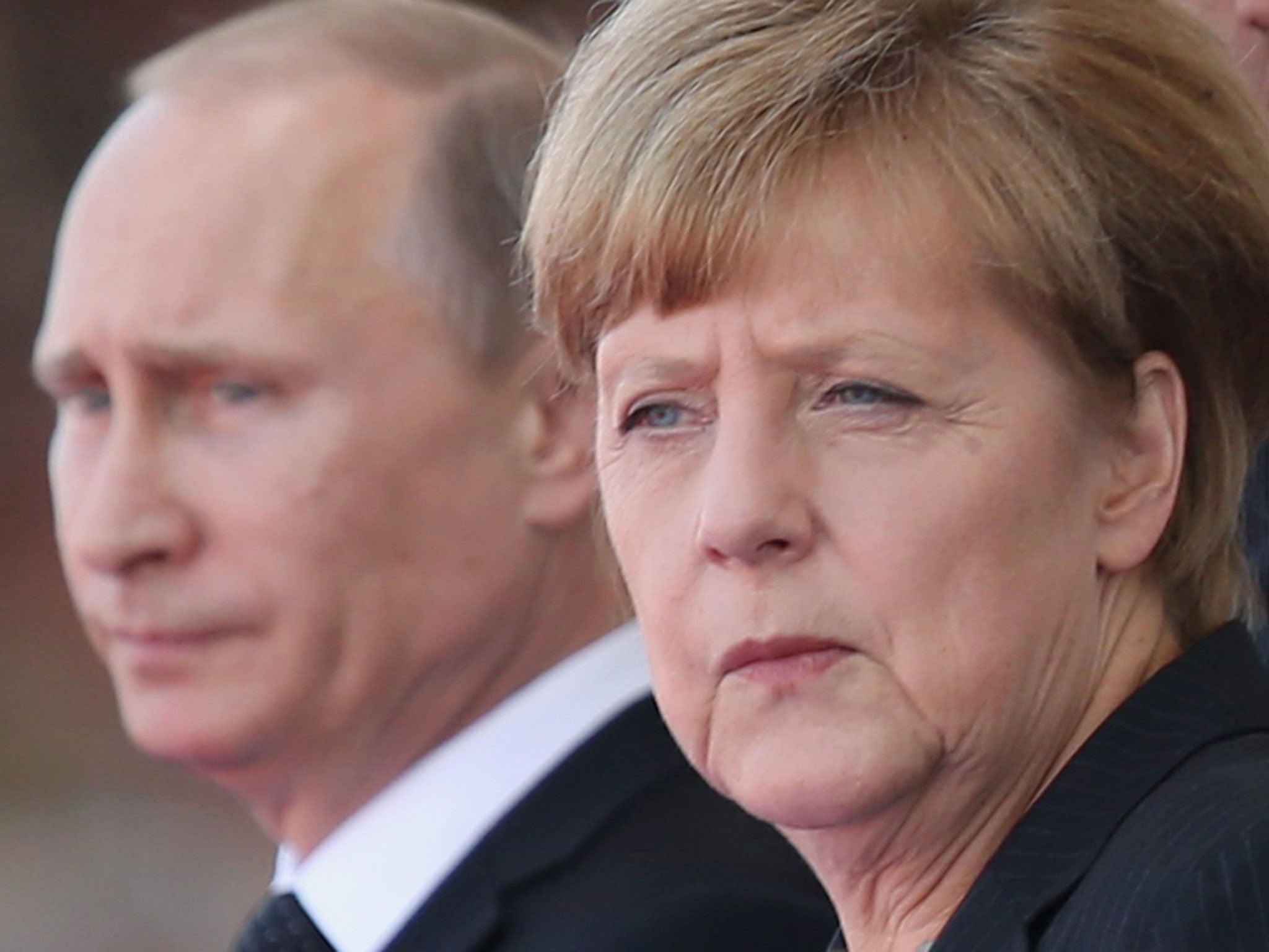 File photo of President Putin and Chancellor Angela Merkel