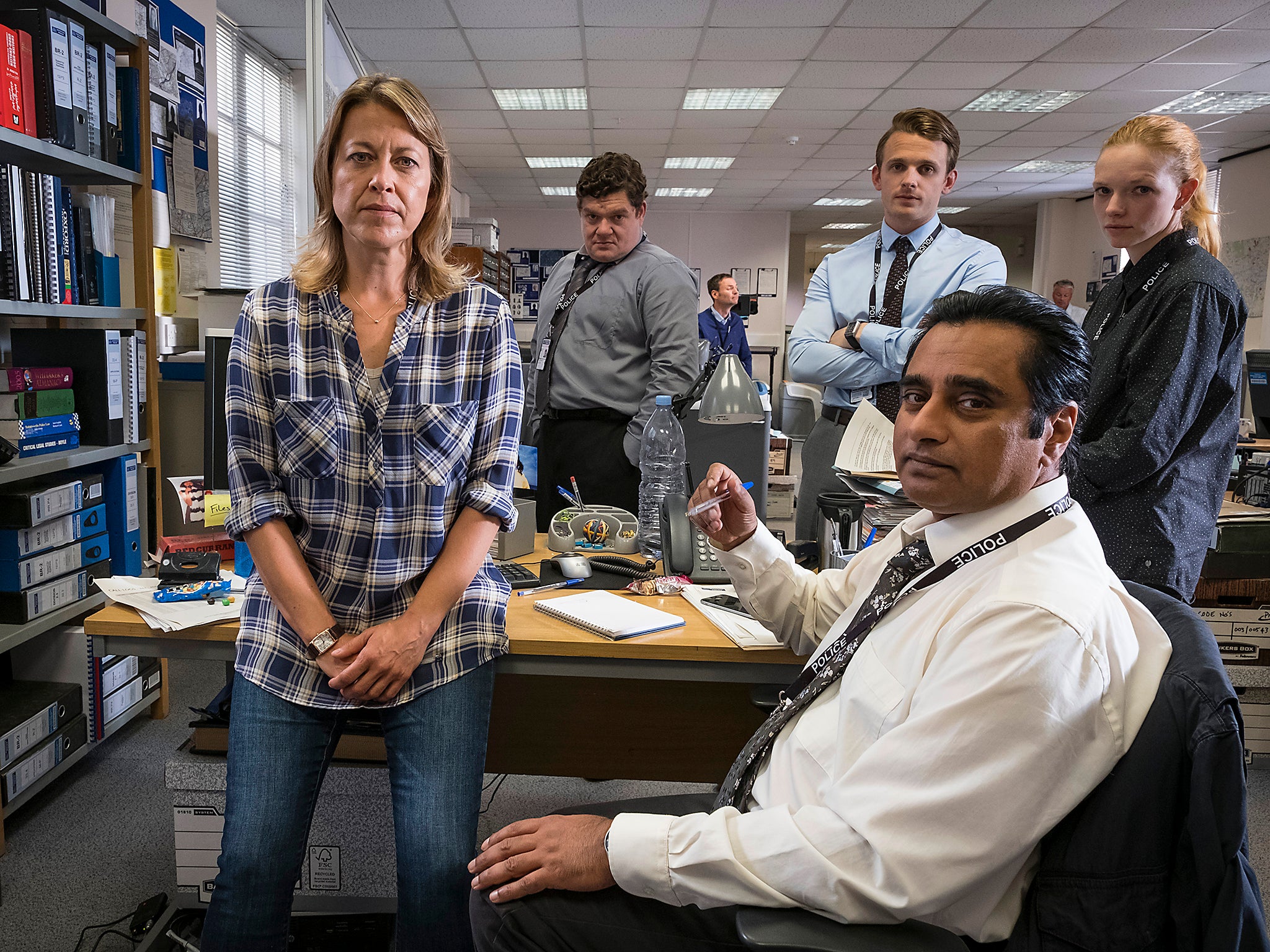 &#13;
Nicola Walker as Cassie and her police partner, Sanjeev Bhaskar as DI Sunny Khan with their team in ITV's 'Unforgotten' &#13;