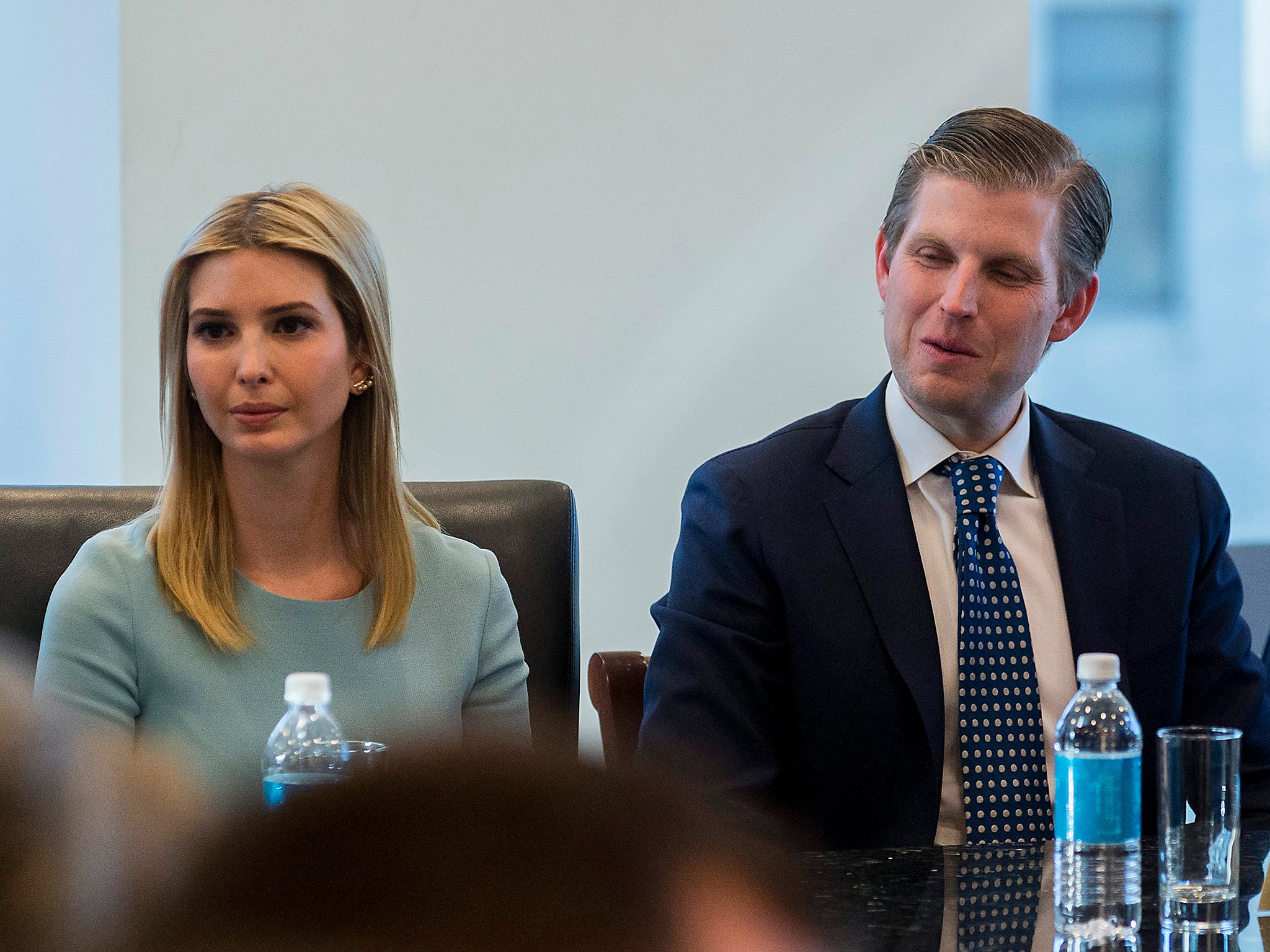 From left to right: Jeff Bezos, Larry Page and Sheryl Sandberg listen to Mr Trump