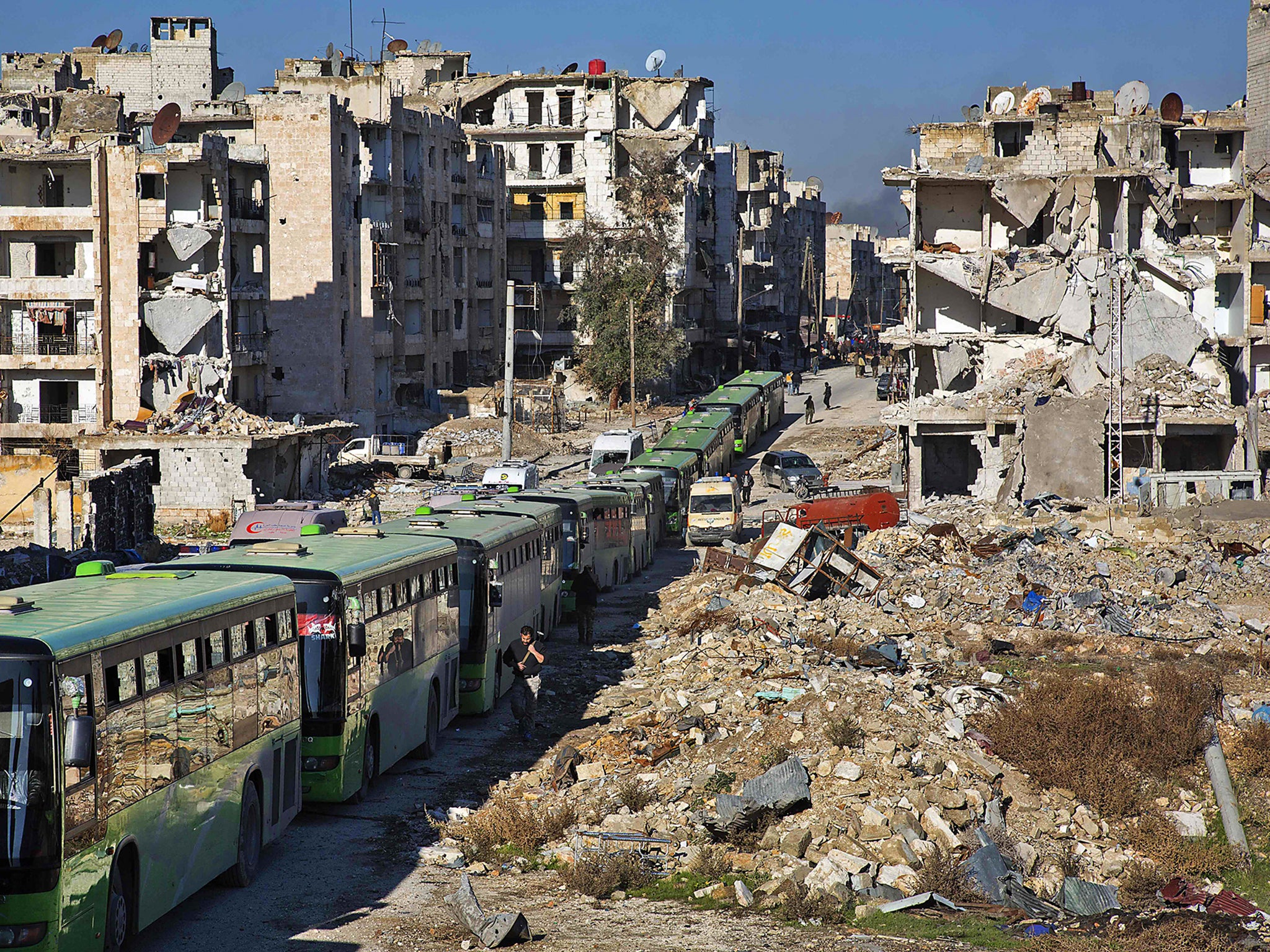 Buses are seen during an evacuation operation of rebel fighters and their families from rebel-held neighbourhoods in the embattled city of Aleppo