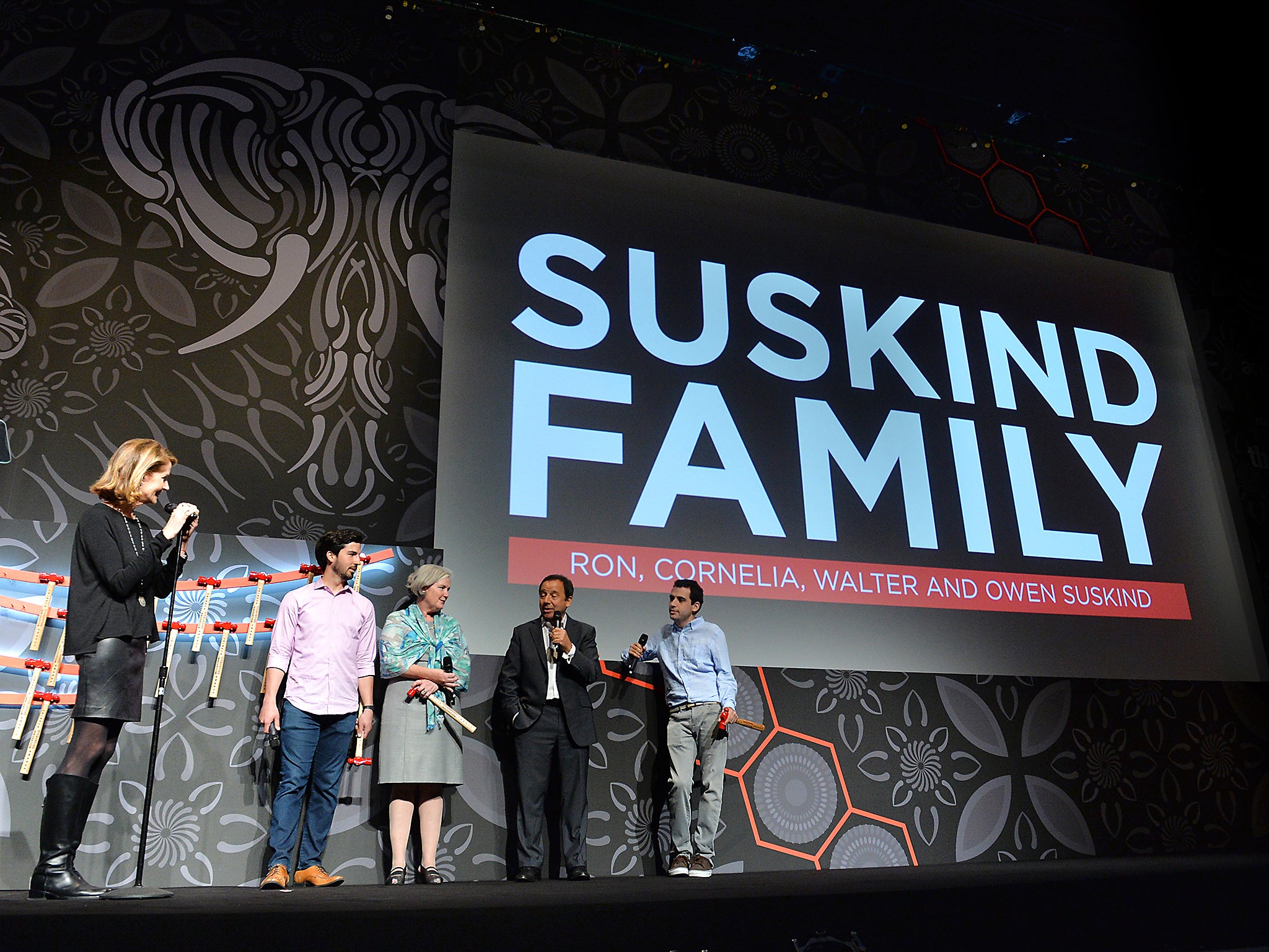 Host Perri Peltz and The Suskind family on stage at Tribeca Disruptive Innovation Awards