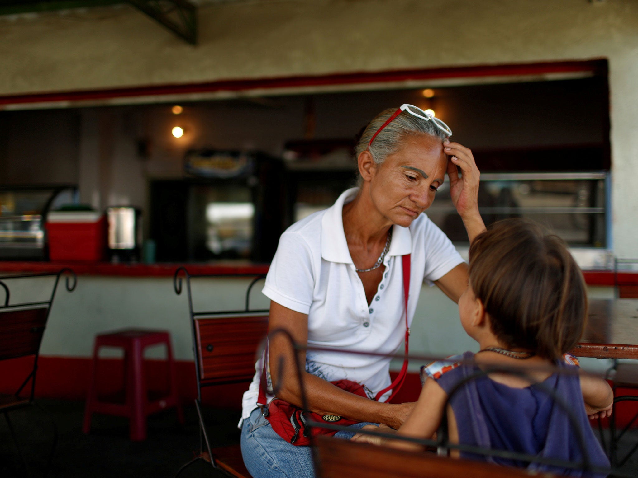 Zulay Pulgar in a coffee shop with her four-year-old son Emmanuel