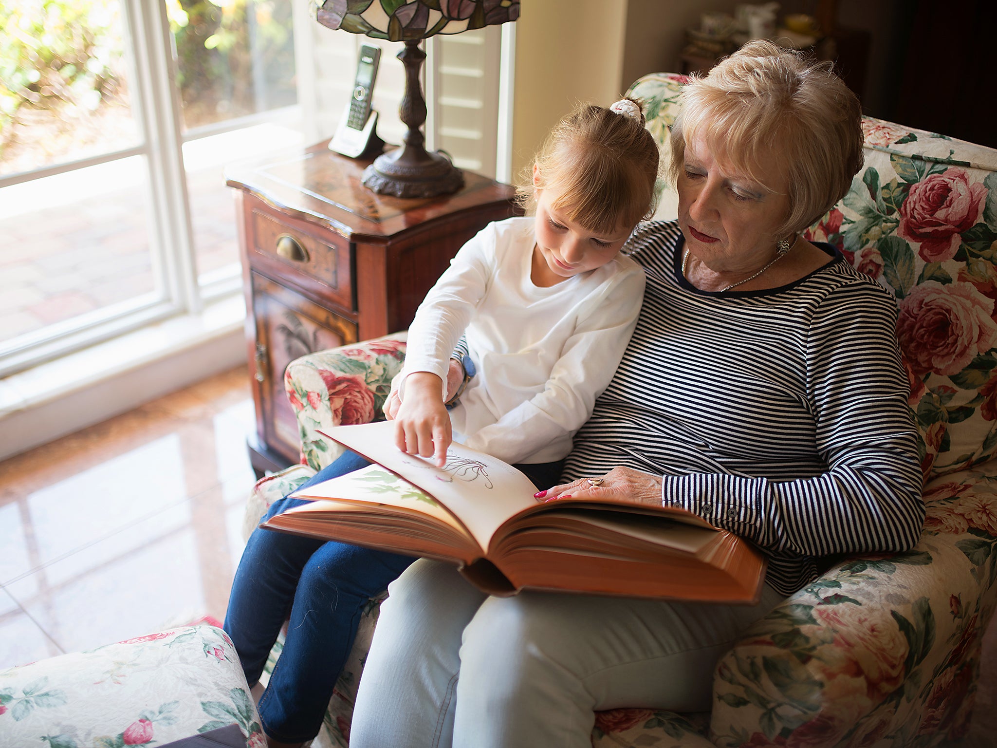 When they read from paper rather than a screen, there was a significant increase in the warmth of the parent/child interactions (Getty)