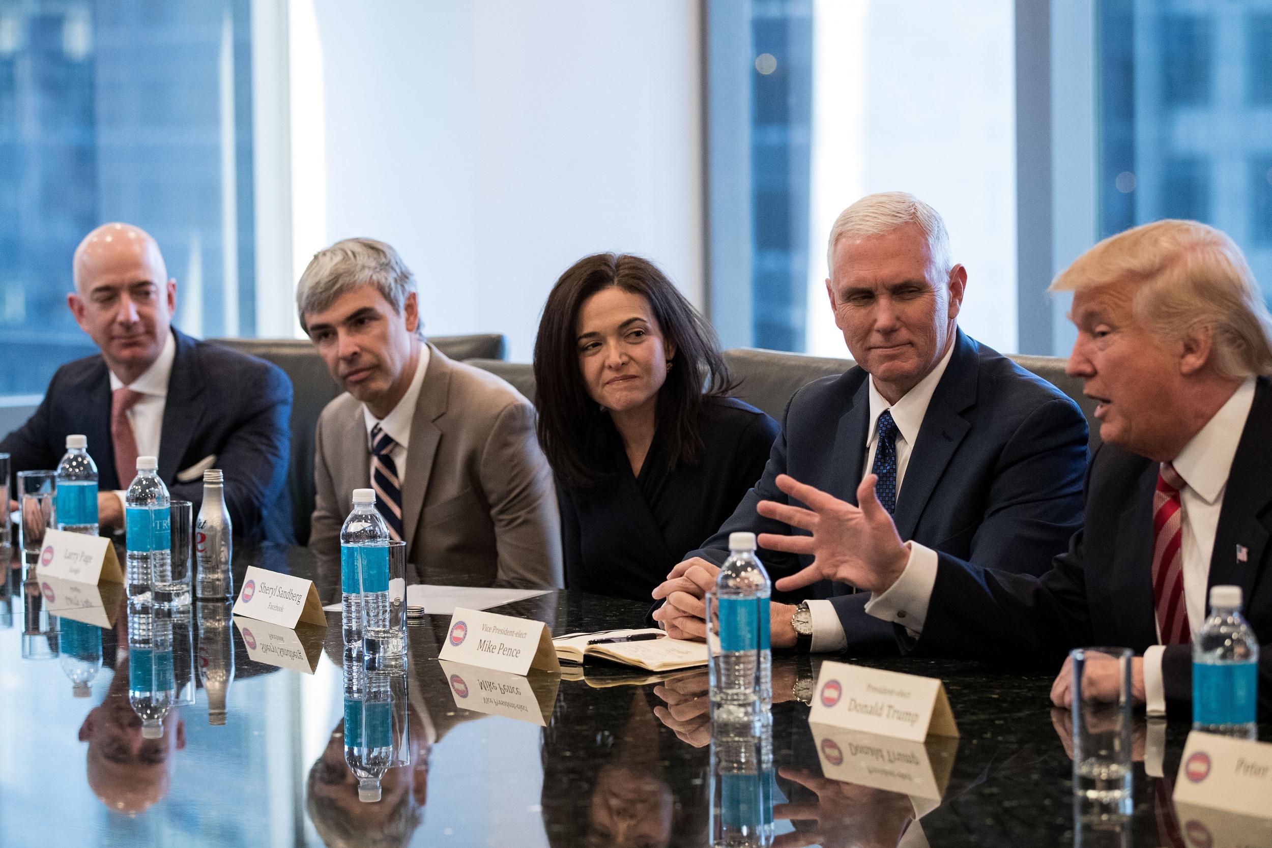 In December 2016 the President-elect and Mike Pence met tech chiefs (from left) Bezos, Google parent Alphabet’s Larry Page and Facebook’s Sheryl Sandberg