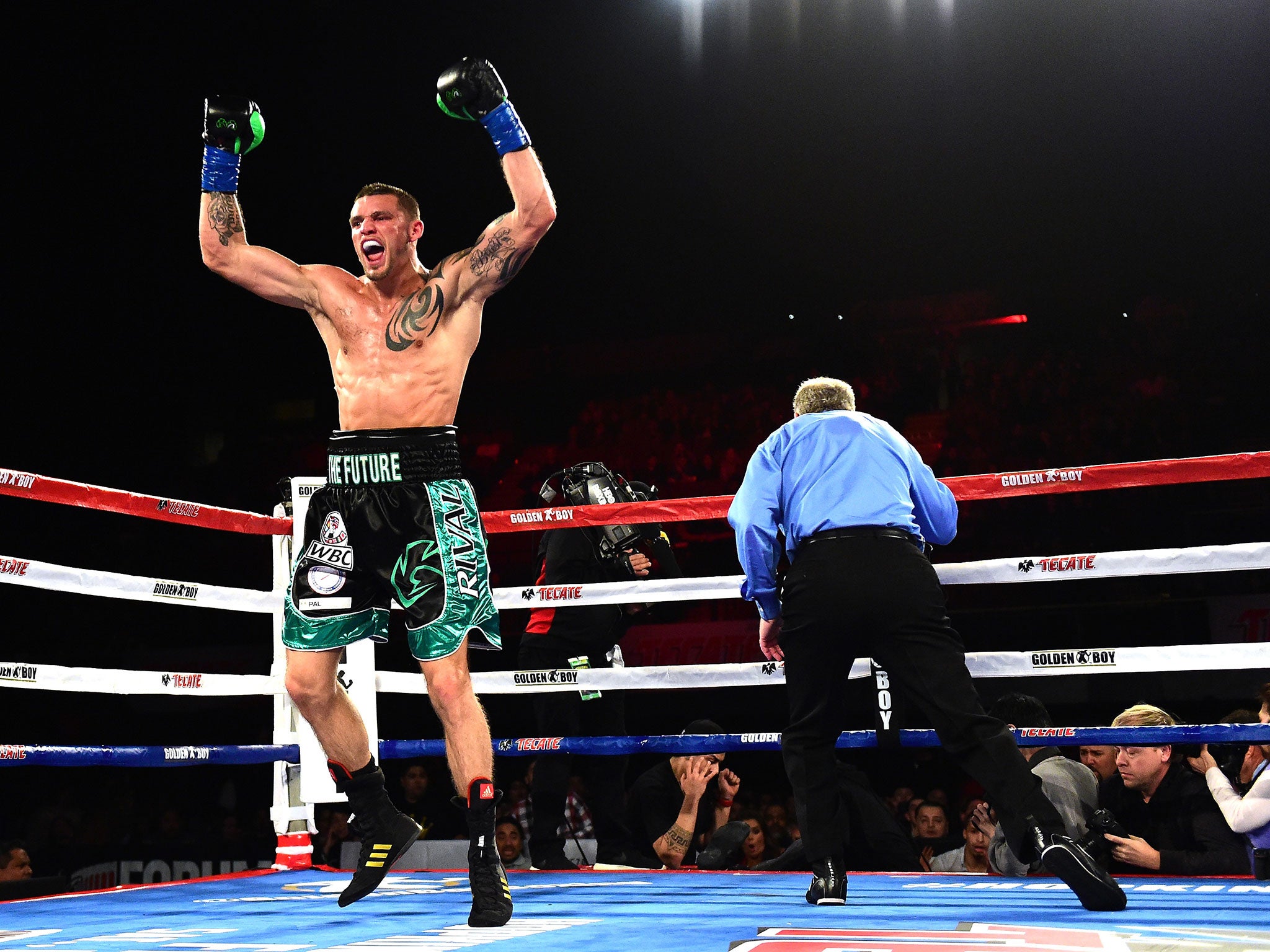 Smith sent Hopkins through the ropes and out of the ring to claim a TKO victory