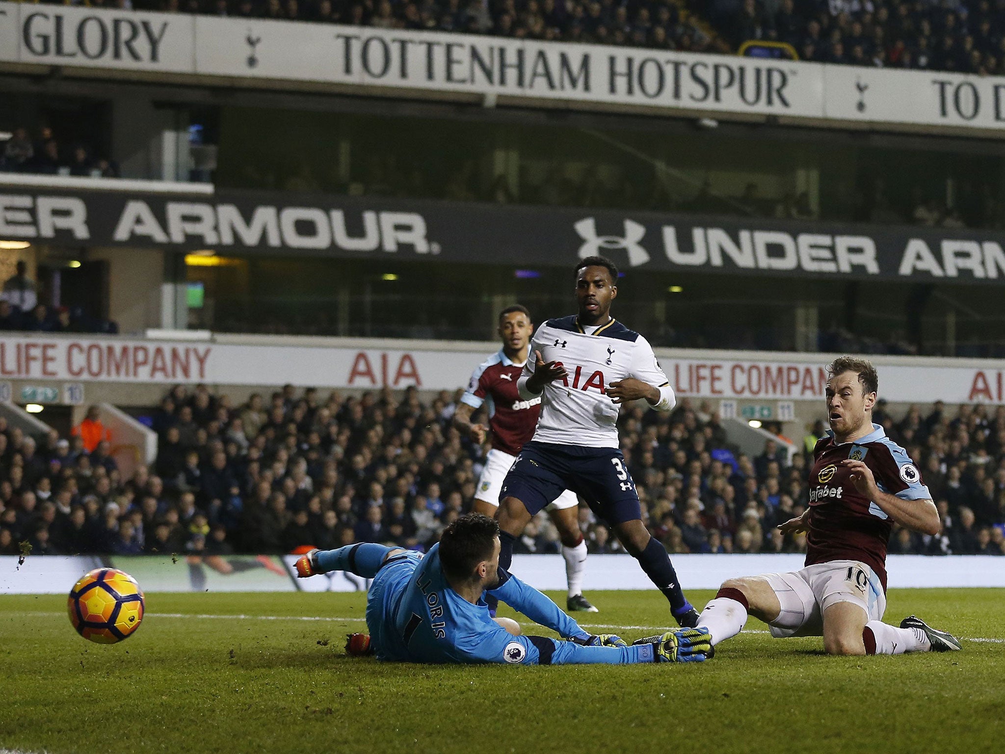 Ashley Barnes sends the ball past Hugo Lloris to hand Burnley the lead