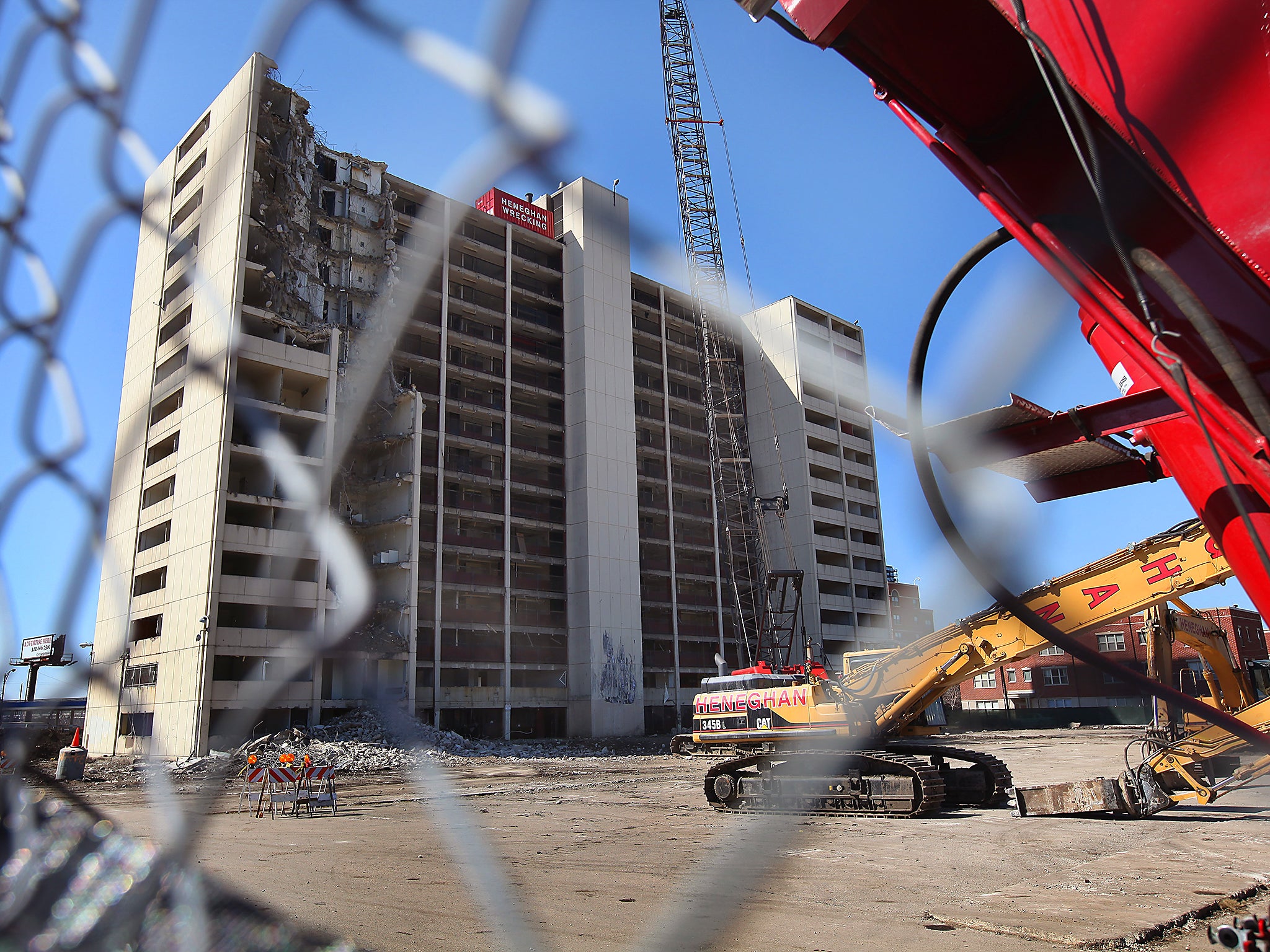 A wrecking crew begins the demolition of the last remaining high-rise building from the infamous Cabrini-Green housing project in Chicago, Illinois