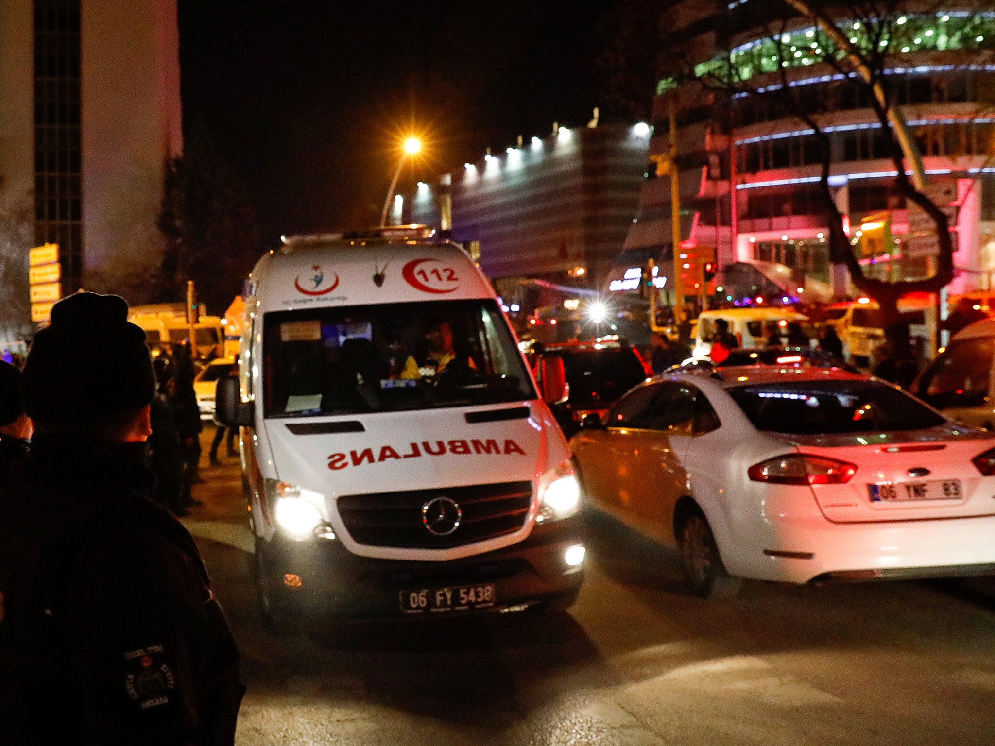 An ambulance leaves the art gallery where the Russian Ambassador to Turkey Andrei Karlov was shot dead, just across the street from the US Embassy