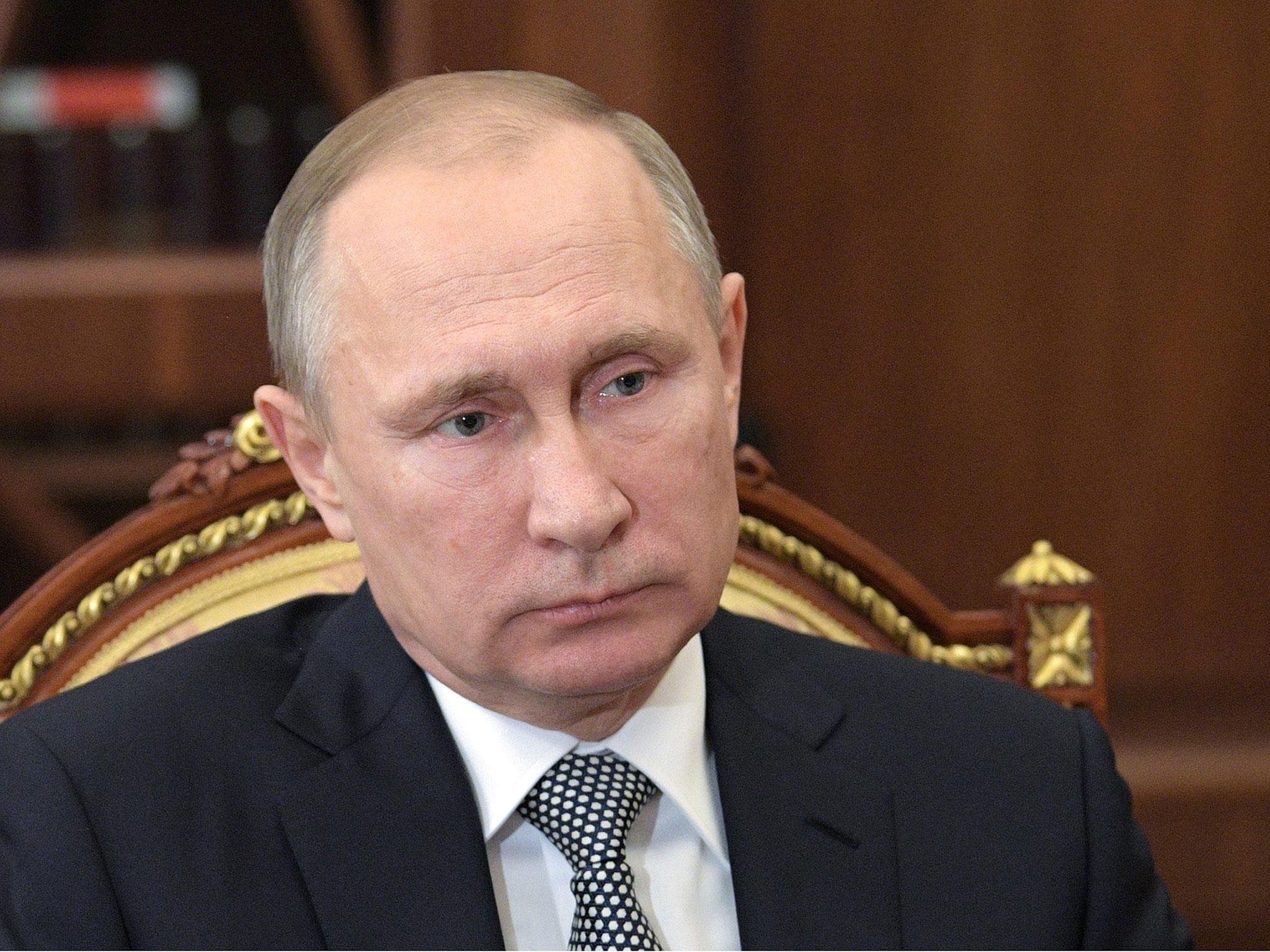 Vladimir Putin says the killing of Andrey Karlov was intended to derail the Syria peace process