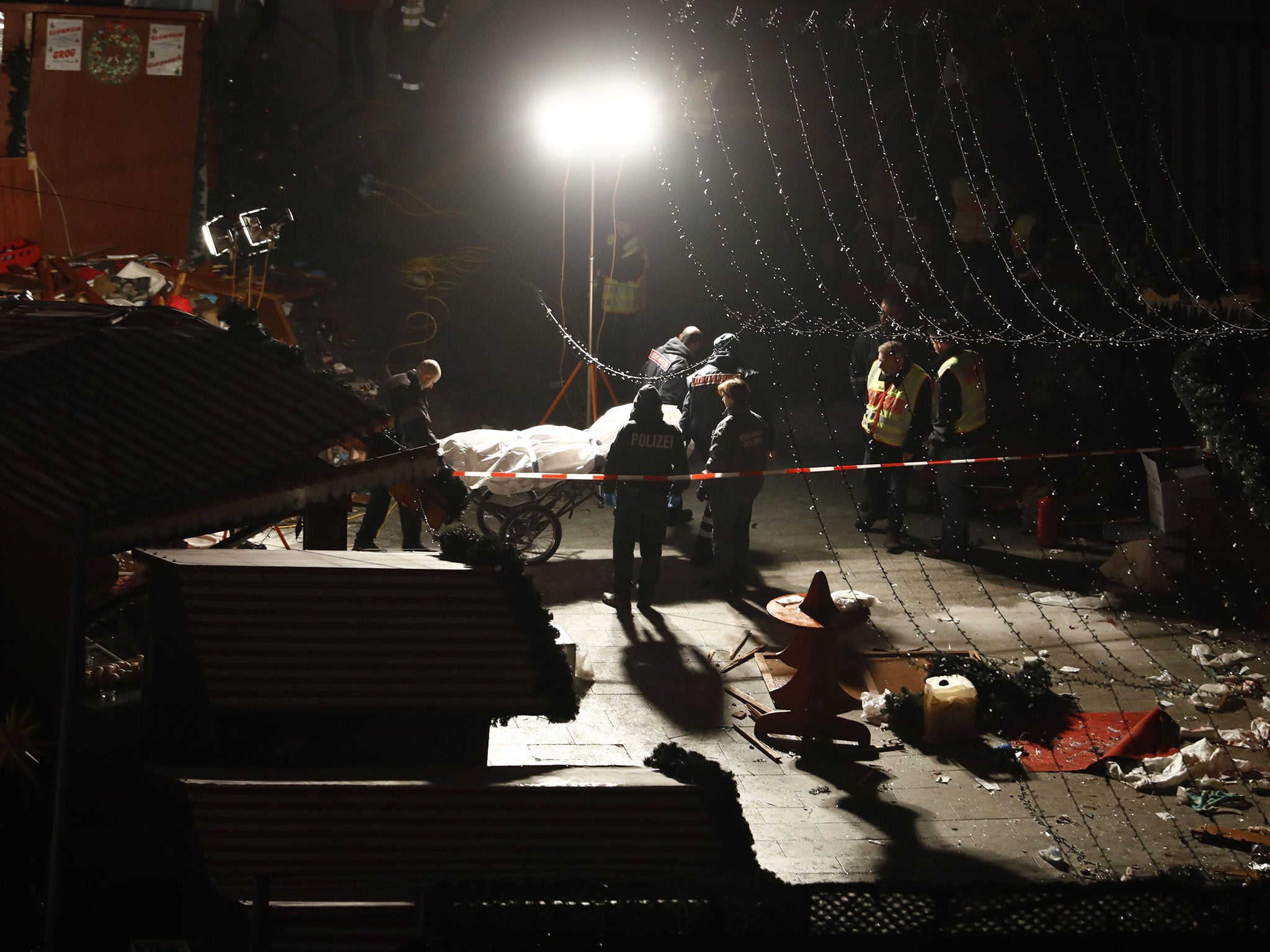 Authorities are seen removing bodies at the Breitscheidplatz market Odd Andersen/AFP/Getty