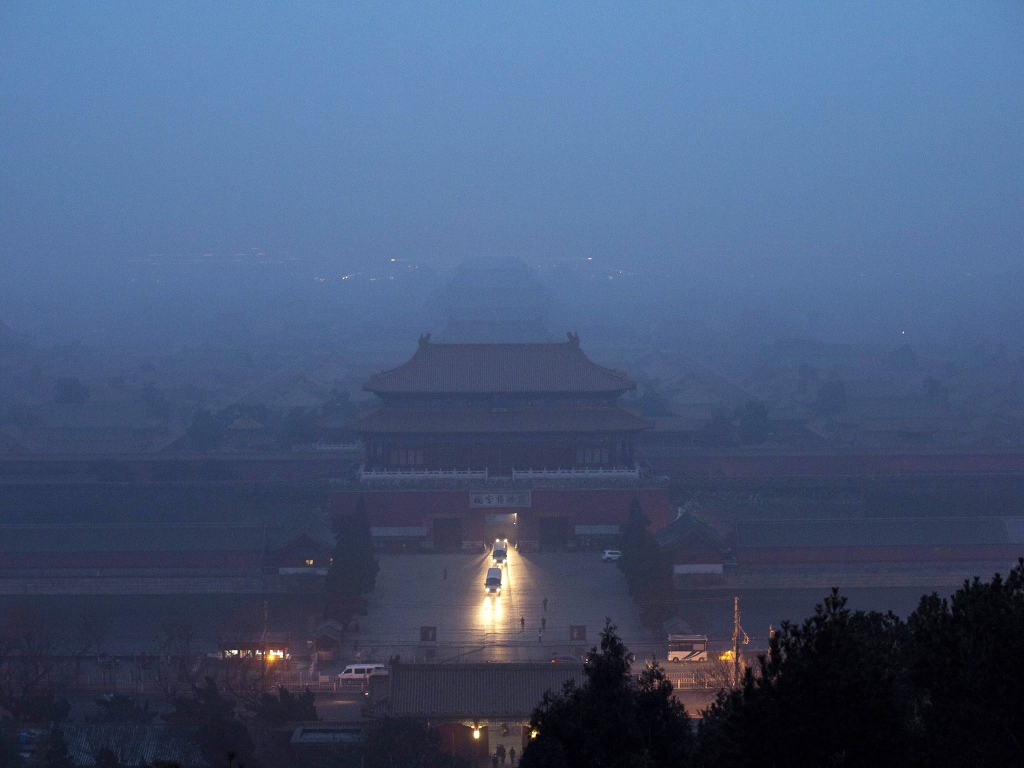 The Forbidden City is seen through heavy air pollution in Beijing