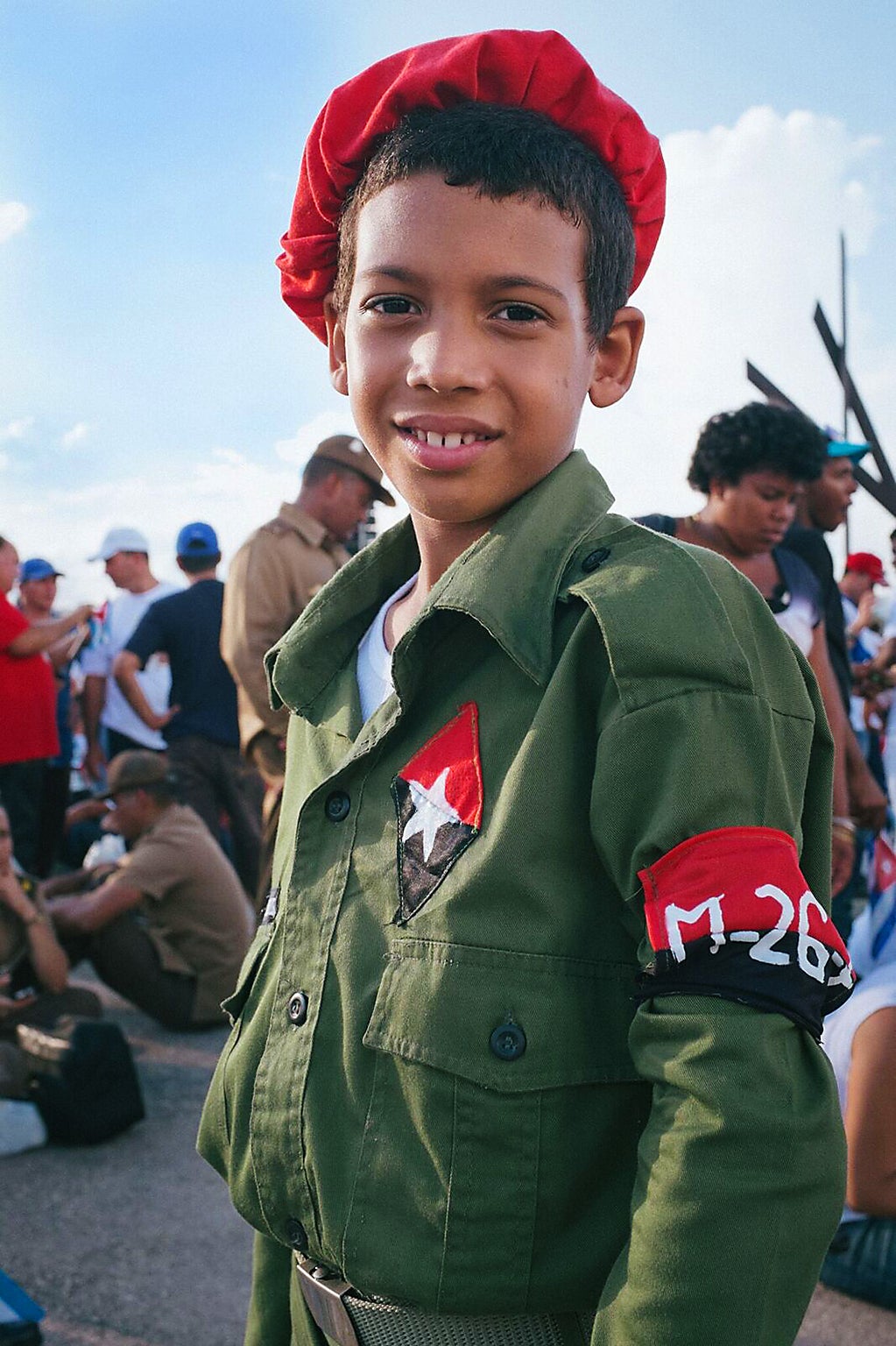 A young Cuban boy in military fatigues at a mass rally in Santiago de Cuba