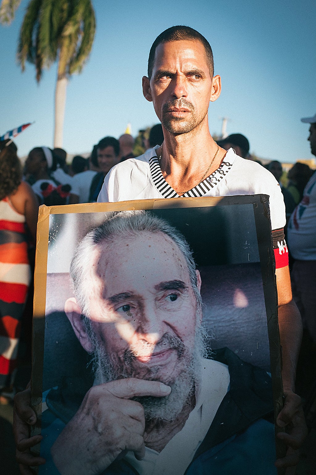 A man with a portrait of Castro outside Santiago de Cuba’s Santa Ifigenia Cemetery