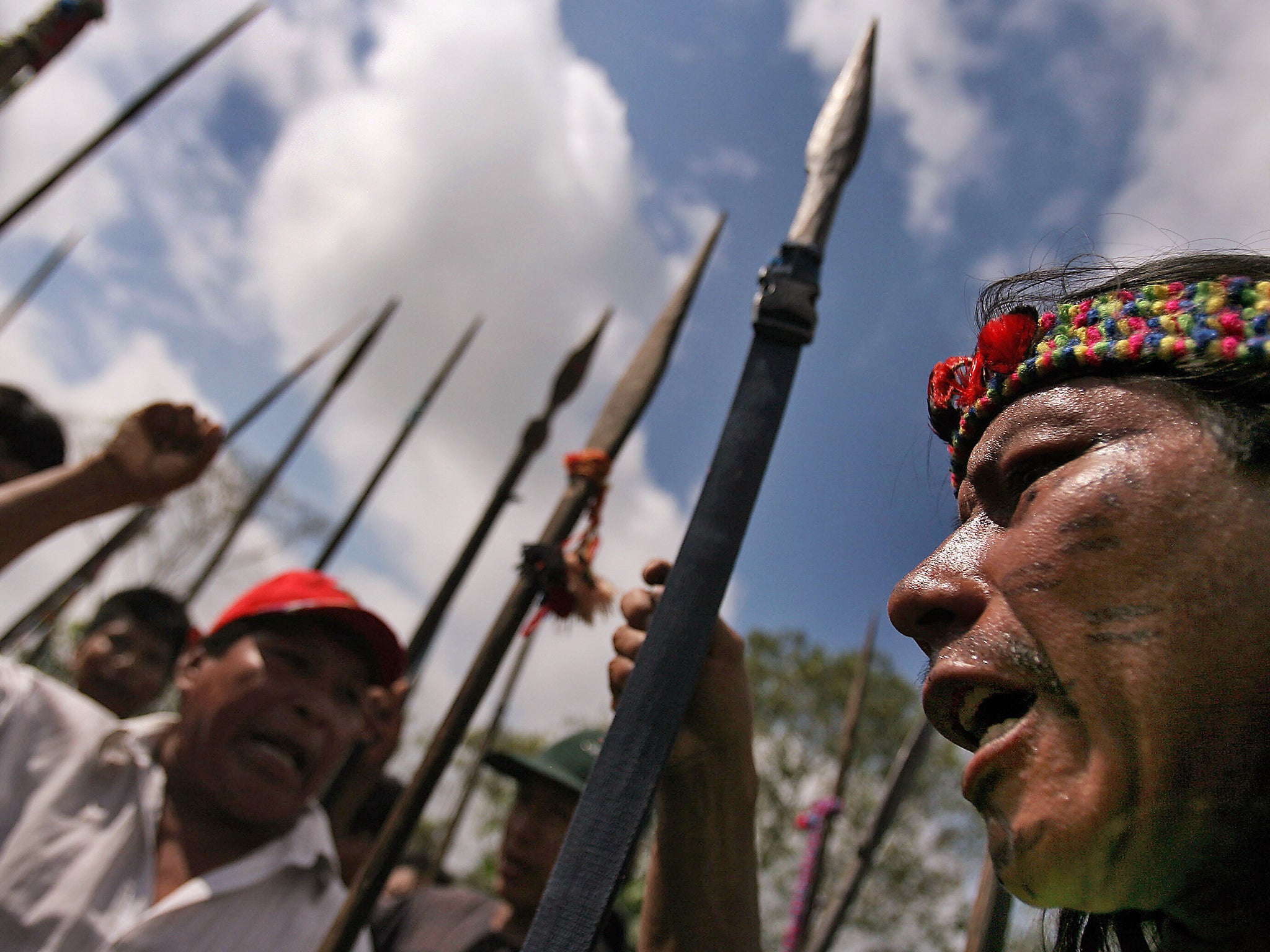 Natives armed with spears set a road blockage at the entrance of the Amazonian town of Yurimaguas, northern Peru