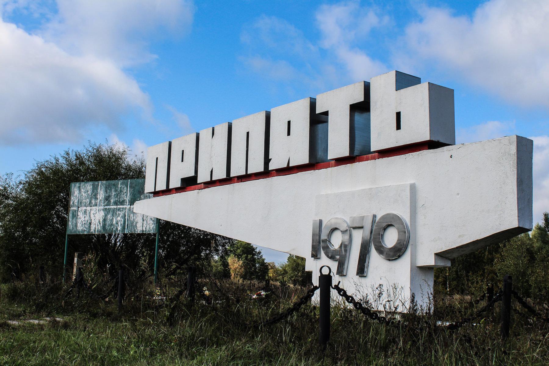 Not far from the reactors, a sign points the way to the abandoned workers’ city of Pripyat