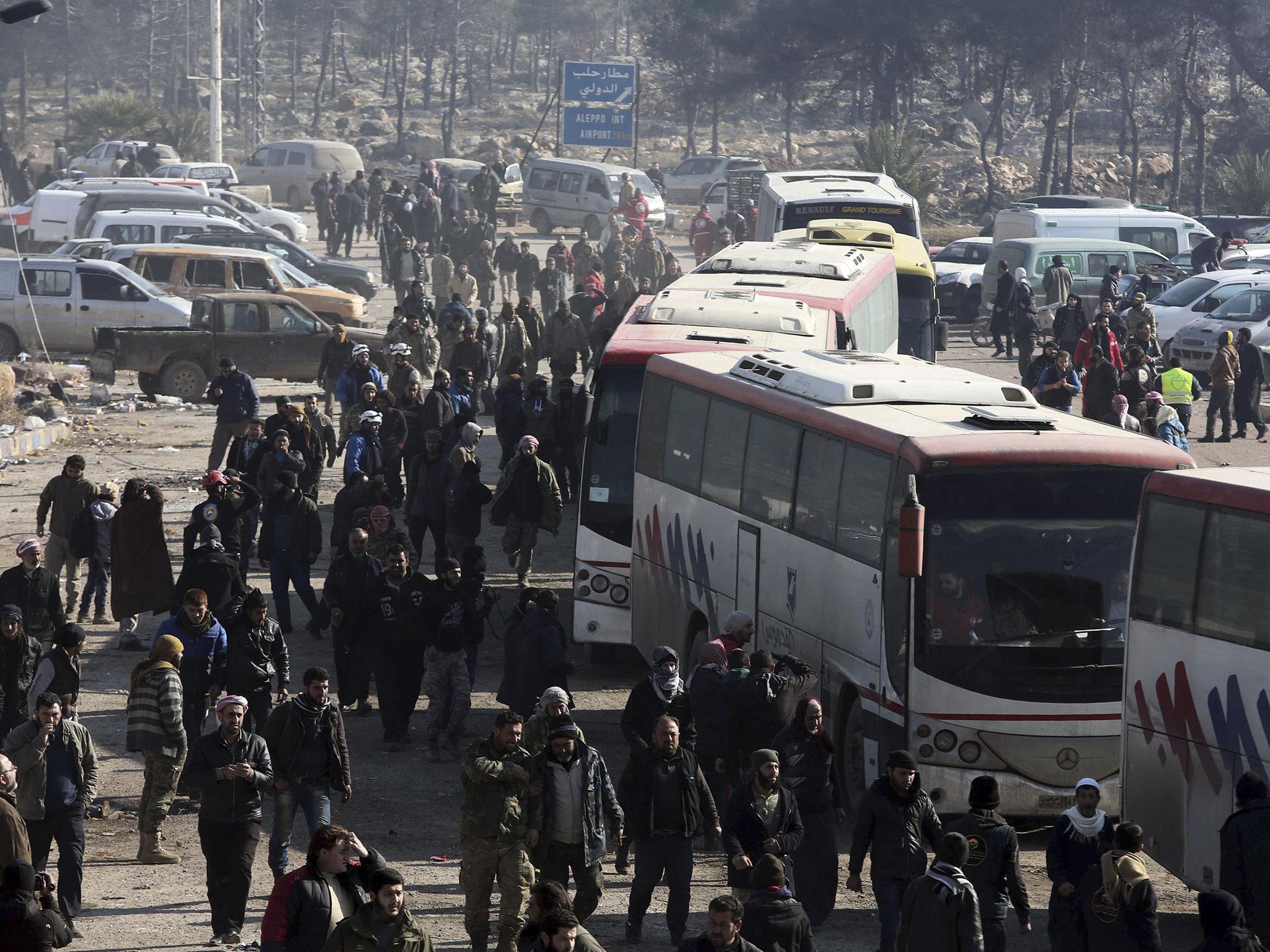 Syrians evacuated from Aleppo arrive at a refugee camp in Rashidin, near Idlib