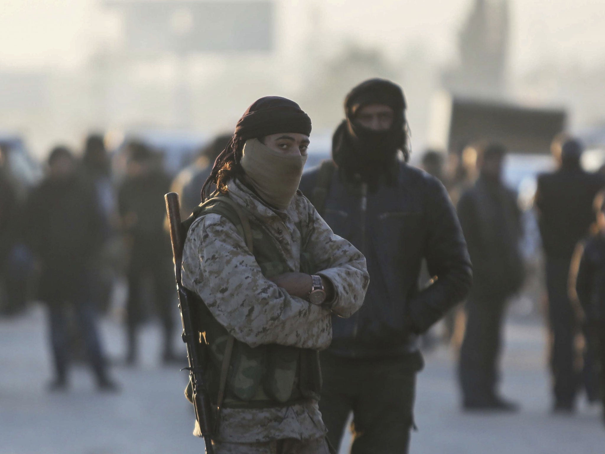 Armed Syrian fighters evacuated from Aleppo arrive at a refugee camp in Rashidin, near Idlib