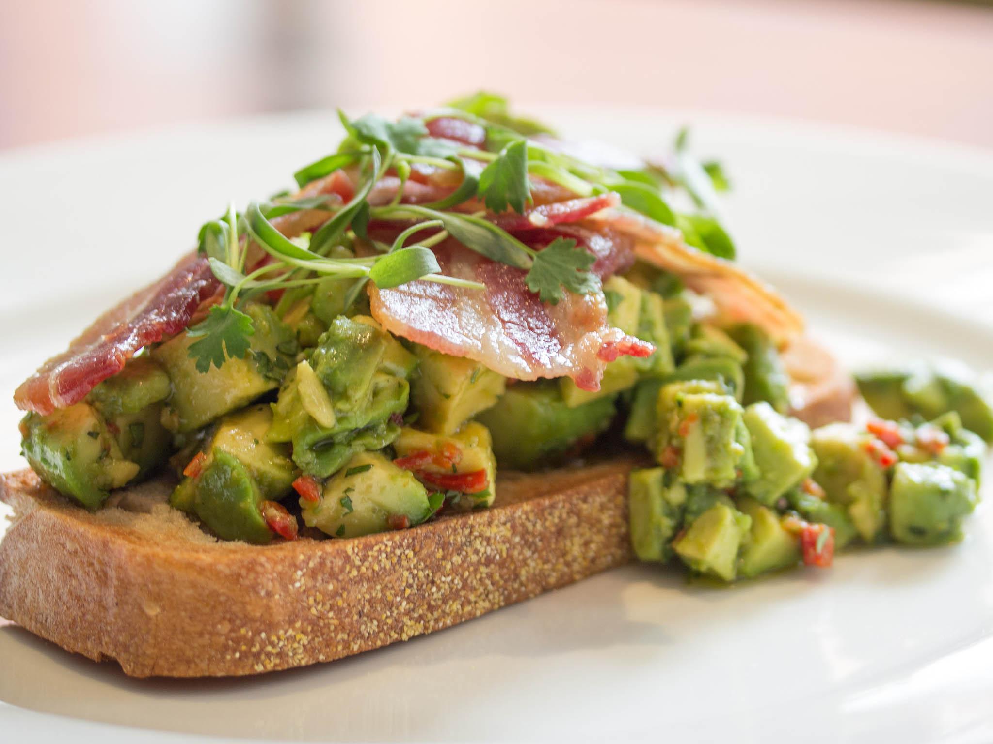 Avocado and chilli on toast with smoked bacon makes for a hearty meal