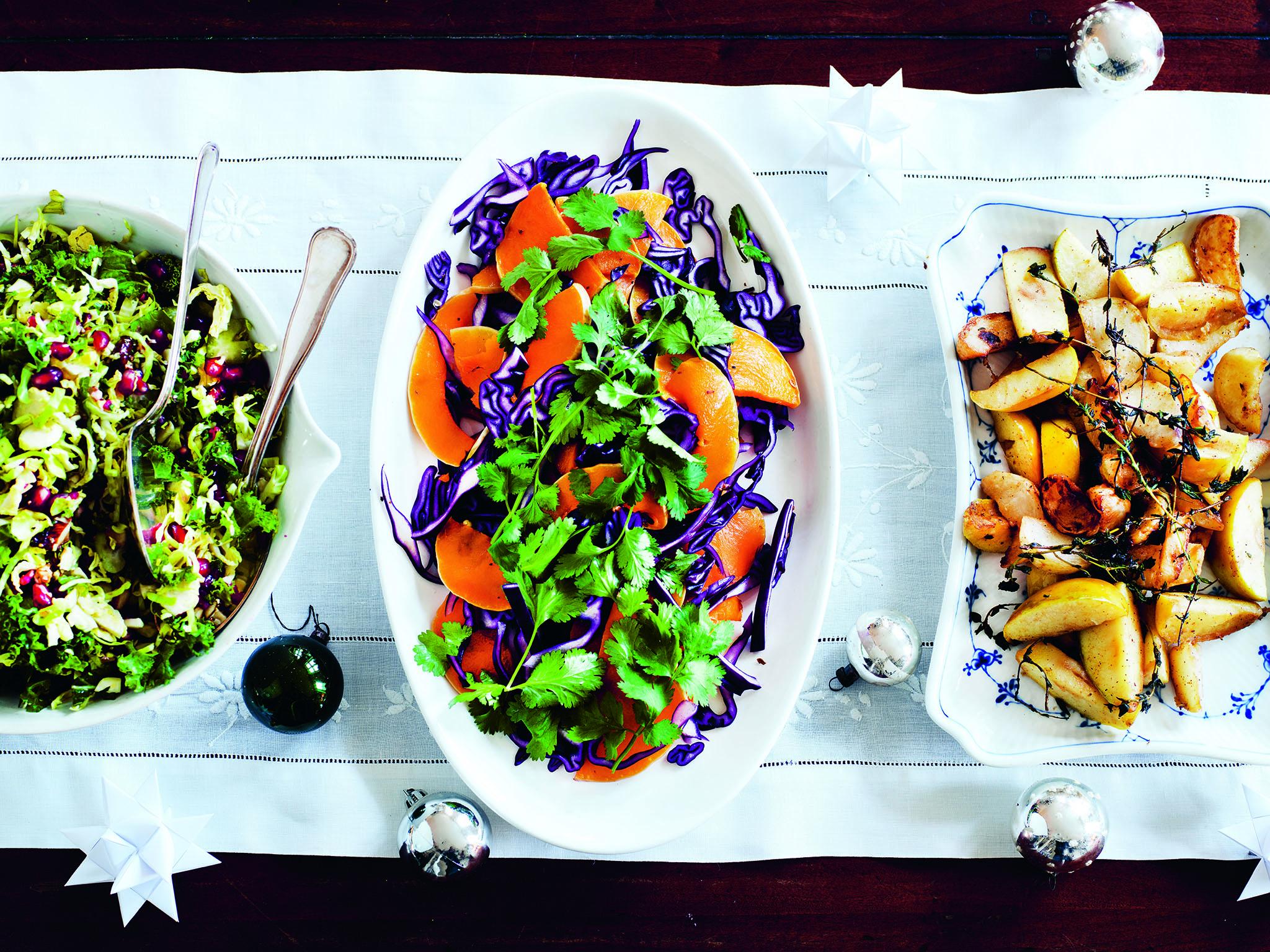 From left to right, red cabbage and pomegranate, butternut squash and turnips and apples