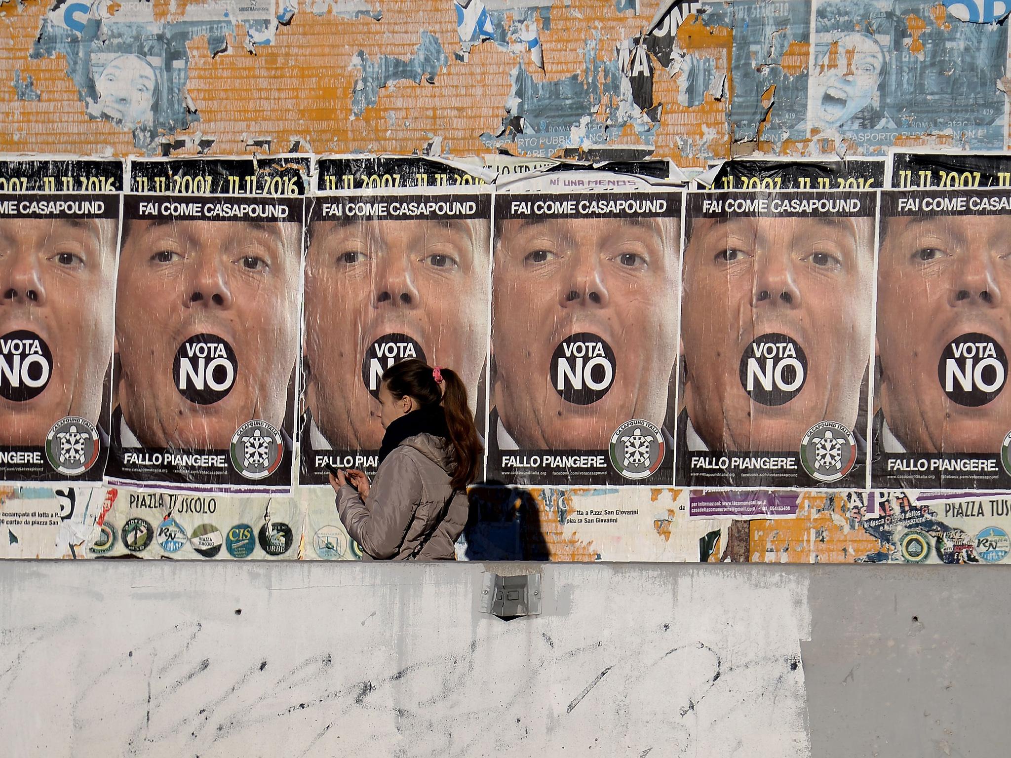 Posters calling for a No vote in Italy’s constitutional referendum in December