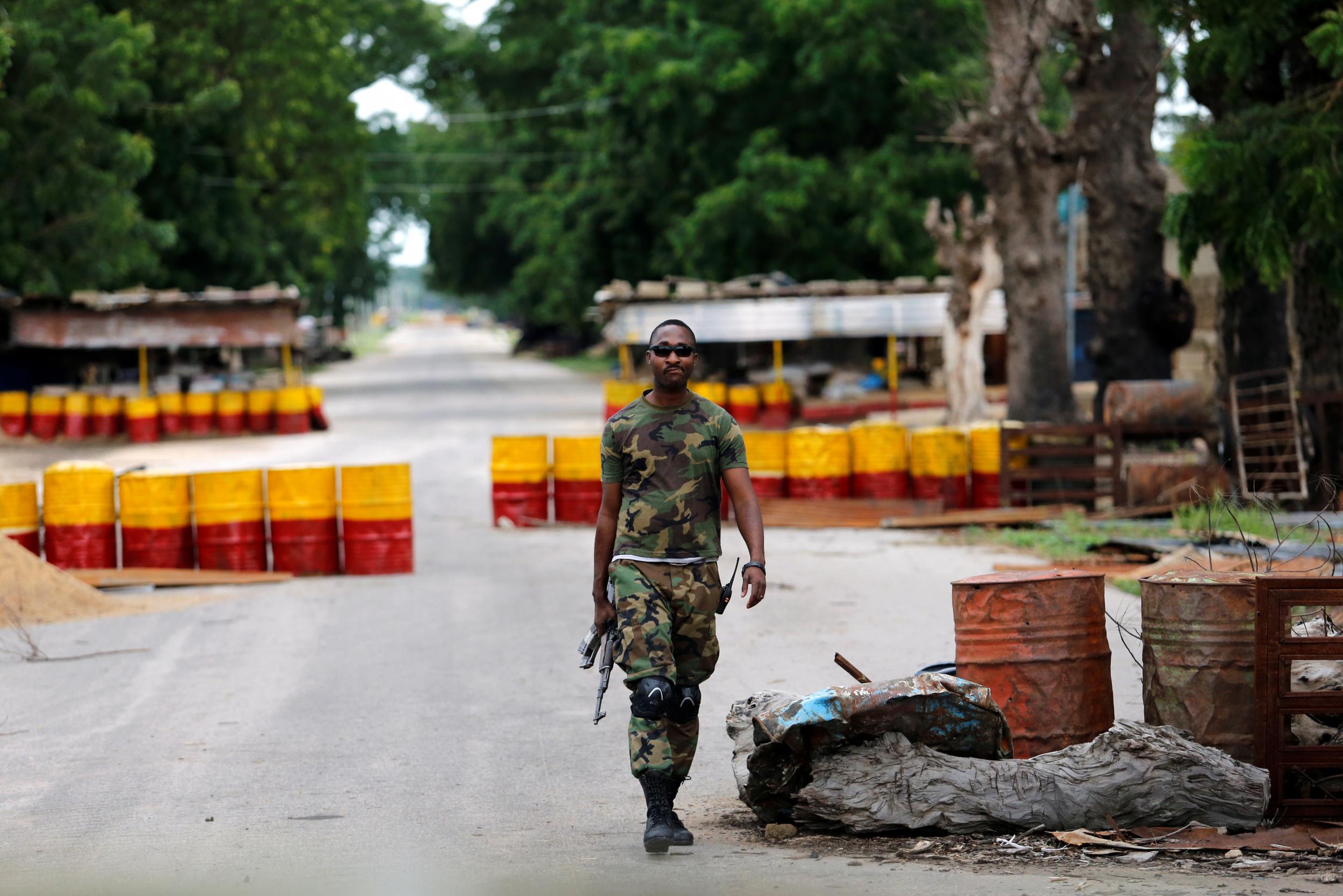 A soldier walks past a checkpoint in the Boko Haram stronghold of Borno State, Nigeria