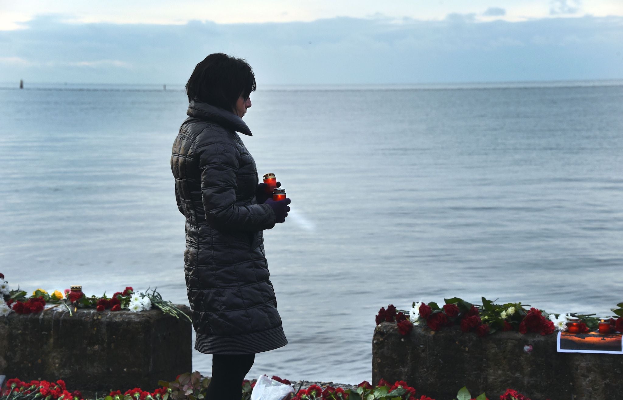 A memorial on a pier outside Sochi, on December 26, 2016, as Russia observes a national day of mourning