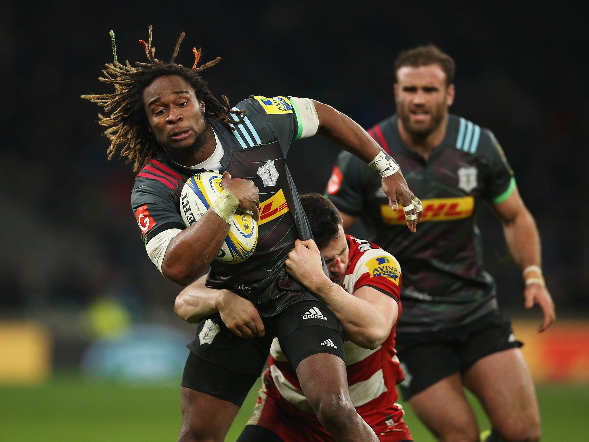 Marland Yarde is tackled by Matt Scott