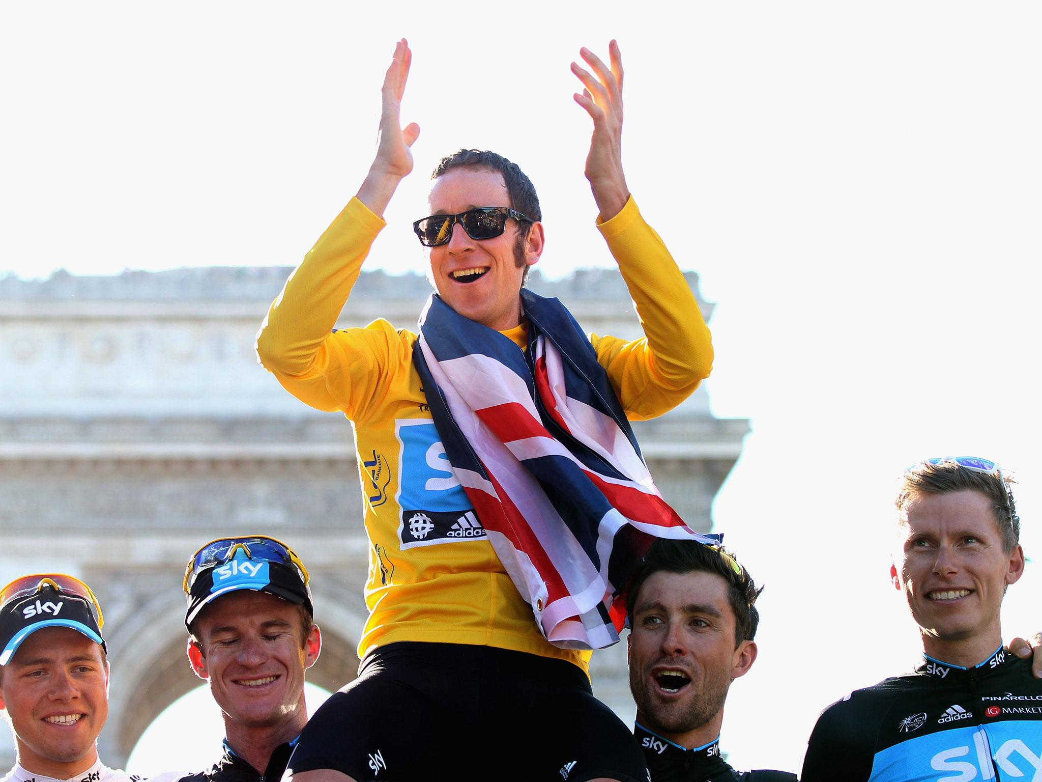 Becomes first British winner of the Tour de France in its 99-year history.