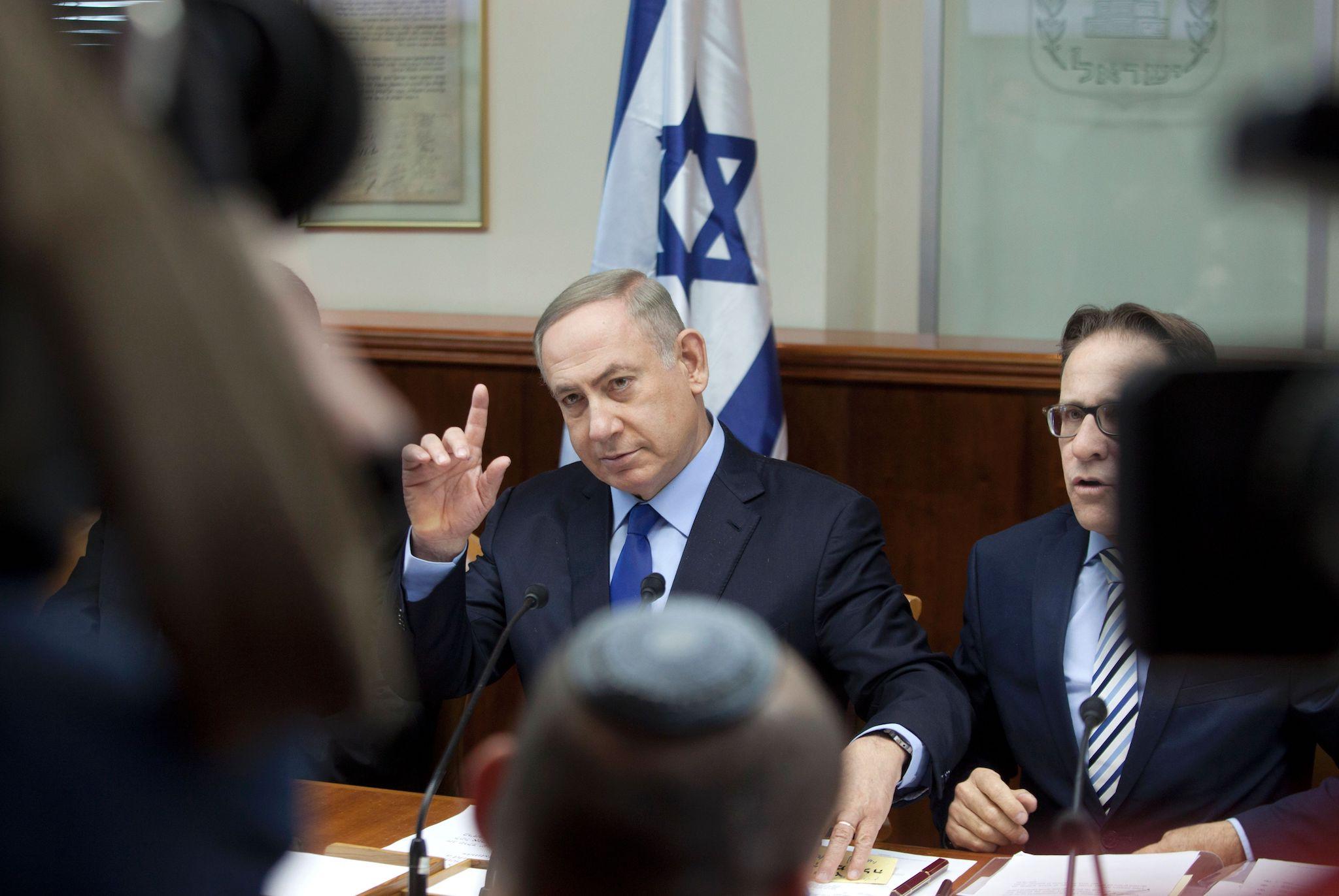 Israeli Prime Minister Benjamin Netanyahu chairs the weekly cabinet meeting in Jerusalem on December 25, 2016. Israel was defiant over a UN vote demanding it halt settlements in Palestinian territory, after lashing out at US President Barack Obama over the 'shameful' resolution