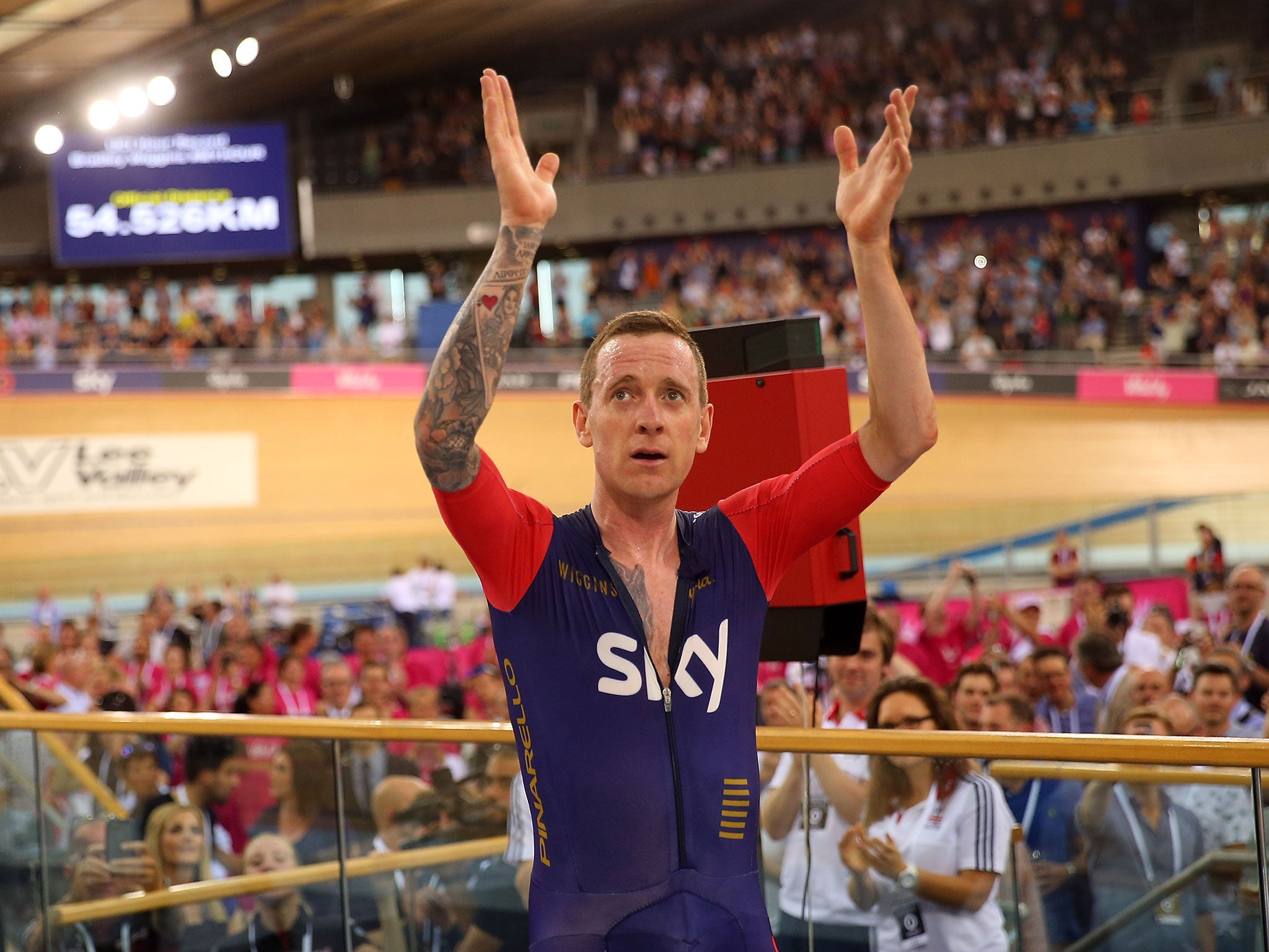 Bradley Wiggins celebrates breaking the UCI One Hour Record at Lee Valley Velopark Velodrome on June 7, 2015 in London