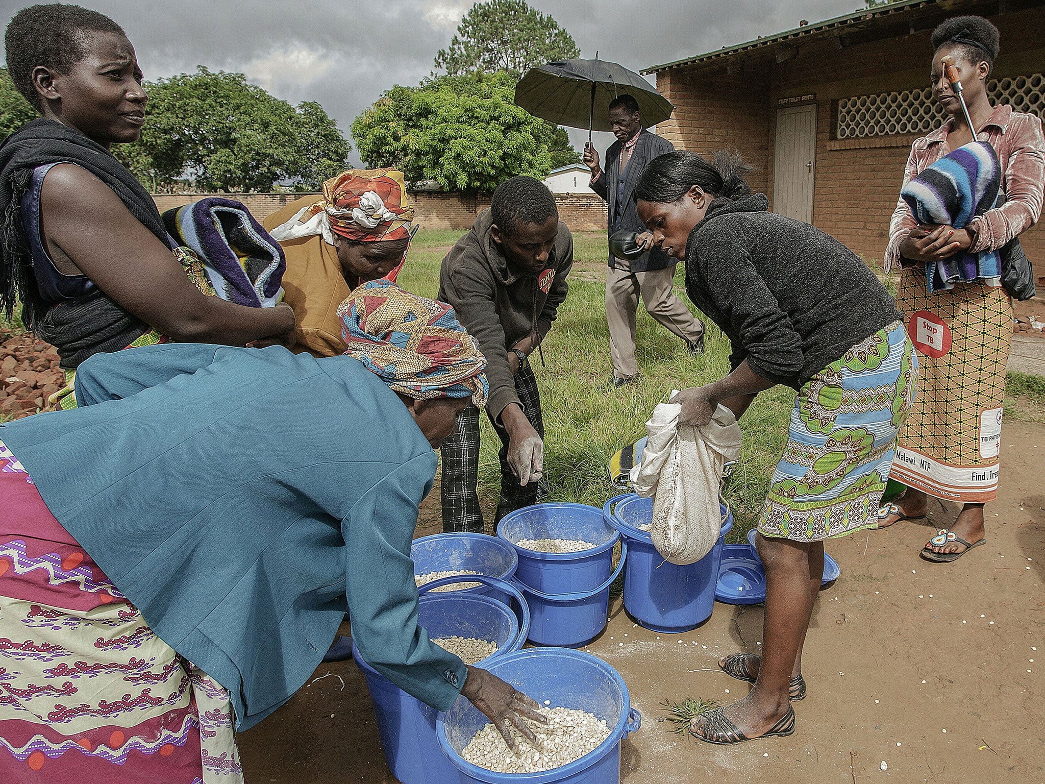 Mzuzu, pictured here as women take relief items at a local school after flooding in the spring, is Malawi's largest city in the north Getty