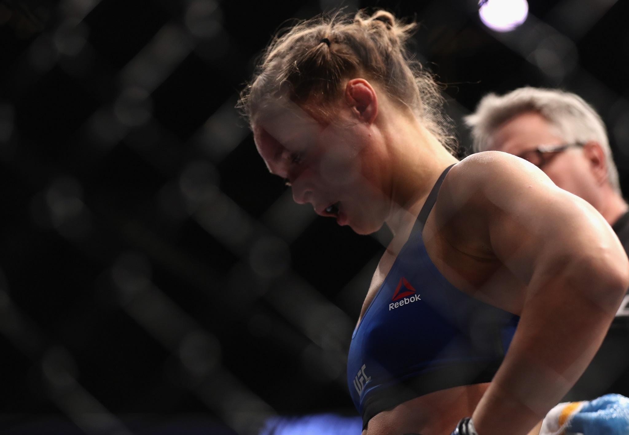 Ronda Rousey reacts with dejection after he UFC 207 knockout defeat by Amanda Nunes