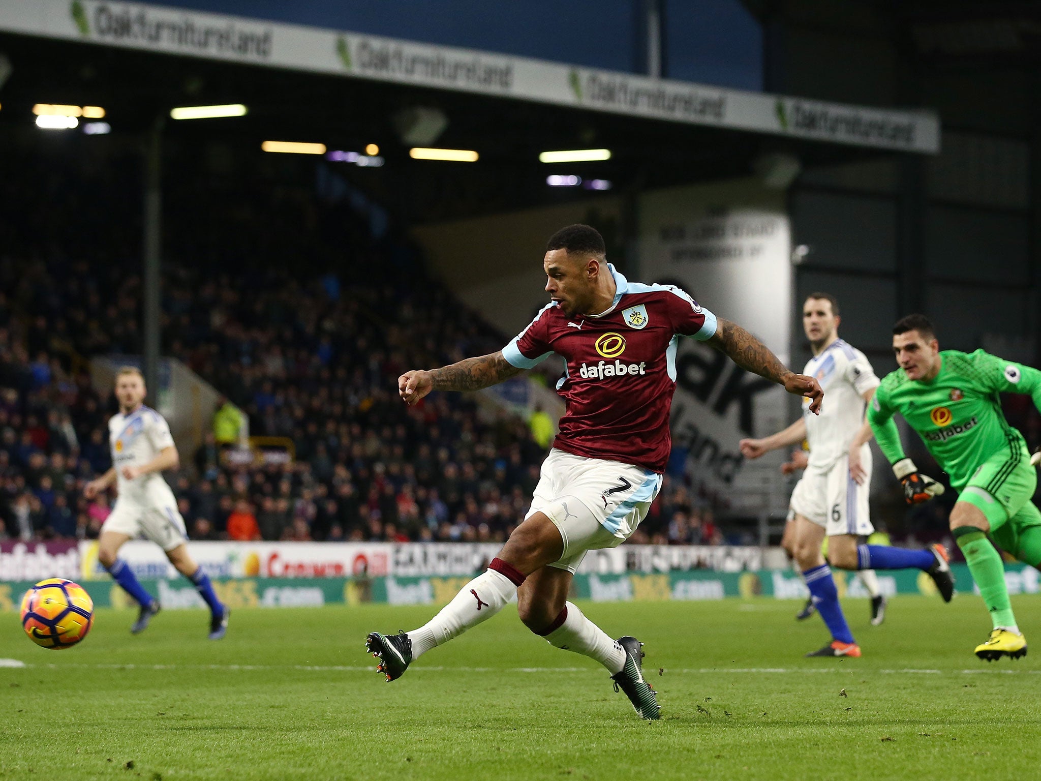 Gray slides home his first goal after rounding Vito Mannone