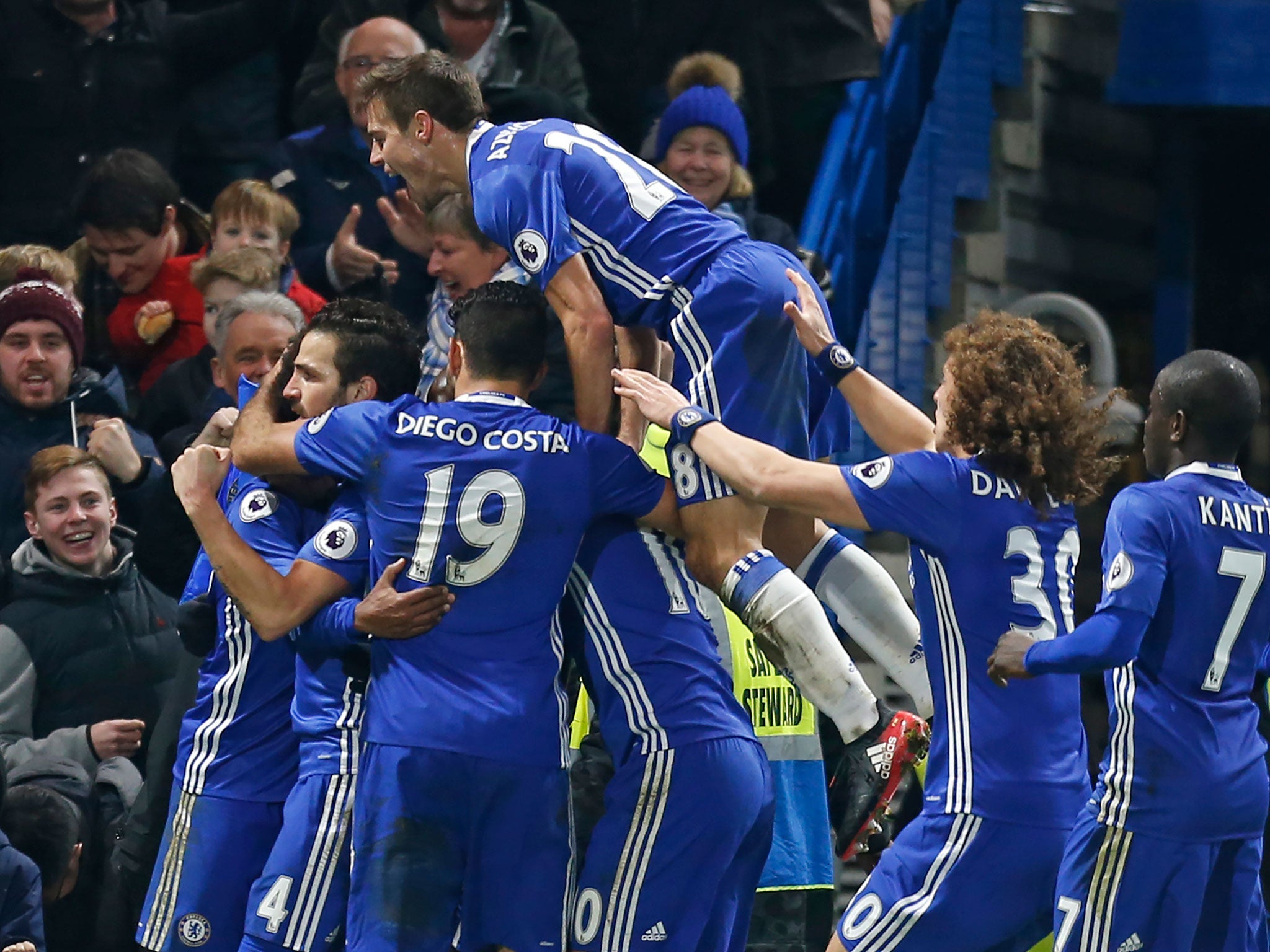 Chelsea players celebrate after Willian put them back in front