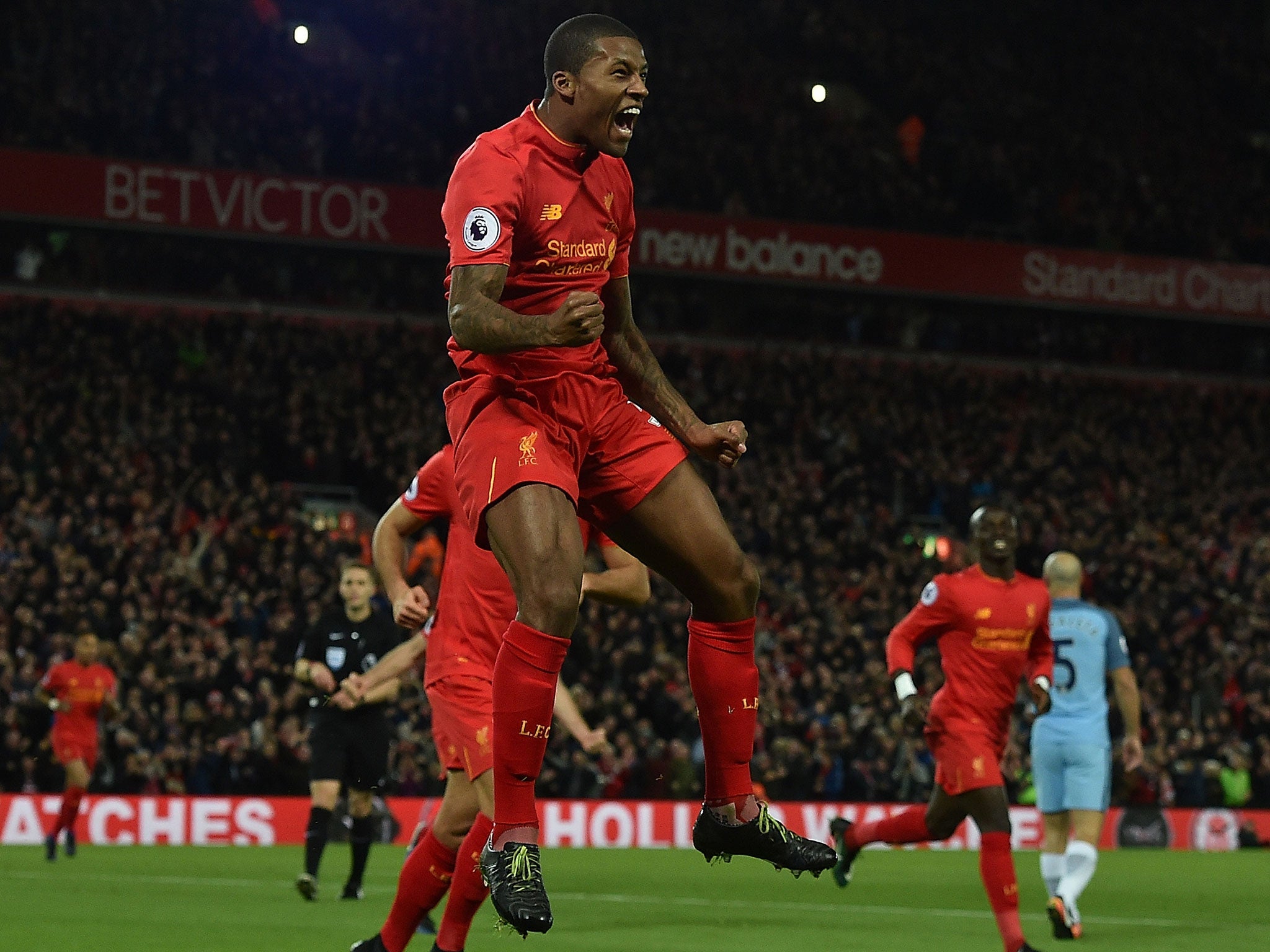 Georginio Wijnaldum celebrates after heading Liverpool into the lead against Manchester City