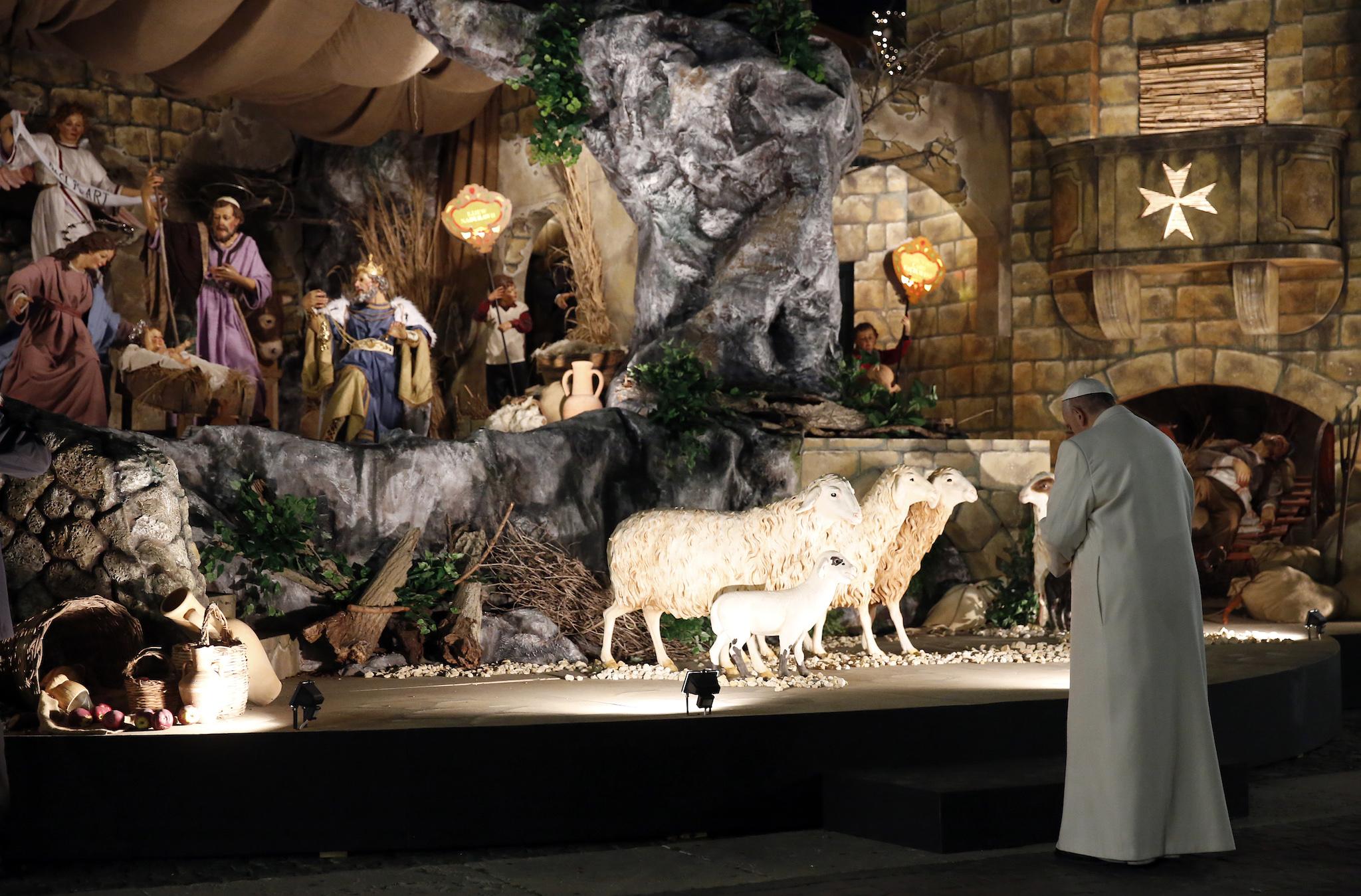 Pope Francis visits the traditional Crib in Saint Peter's Square at the Vatican on December 31, 2016