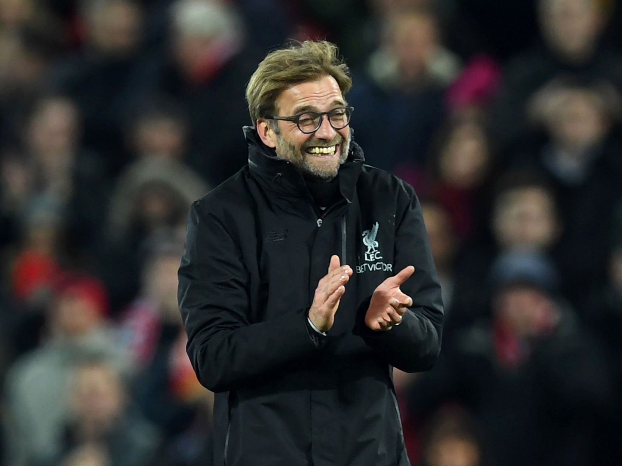 Liverpool's manager Jurgen Klopp celebrates on the pitch after the match between Liverpool and Manchester City at Anfield on December 31, 2016.