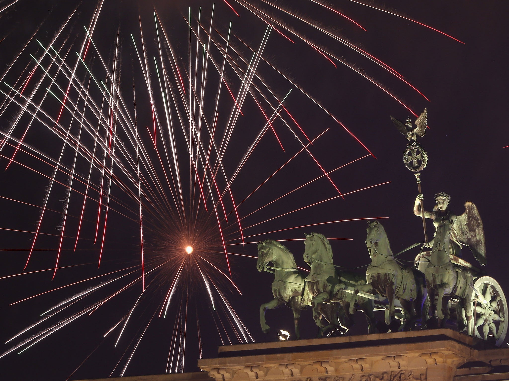 The Brandenburg Gate in Berlin at midnight on New Year’s Eve