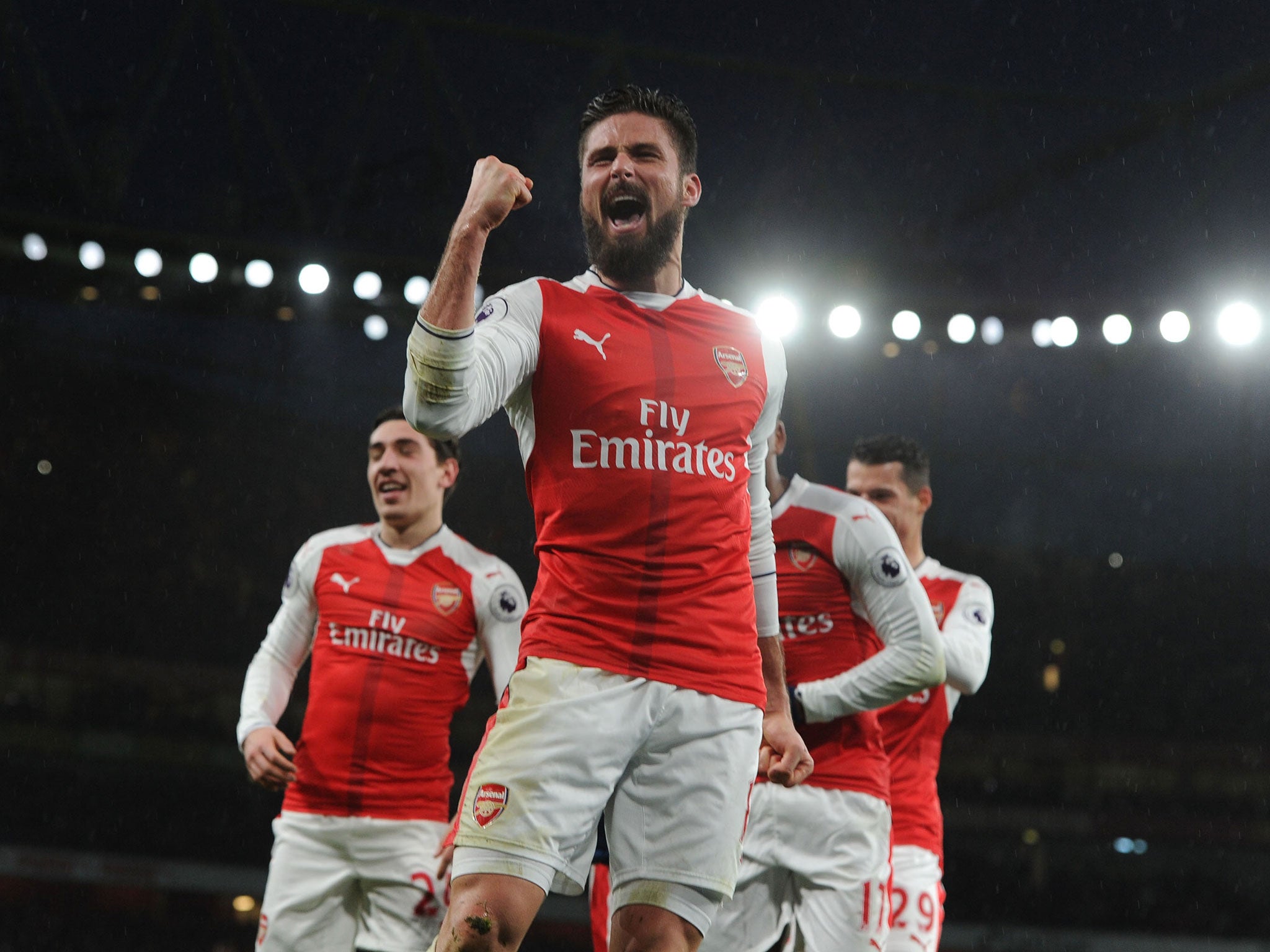 Olivier Giroud celebrates his sensational scorpion strike at the Emirates